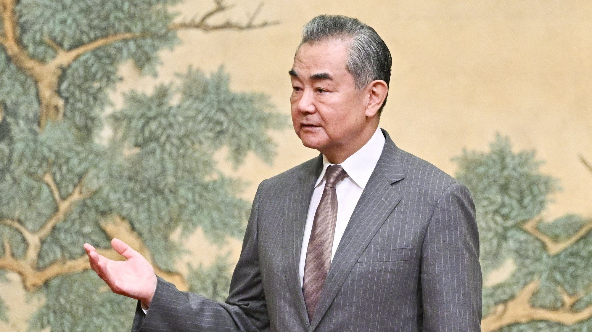 epa11492198 China&#039;s Foreign Minister Wang Yi gestures during an event hosting the vice chairman of the Central Committee of Palestinian organization and political party Fatah and the senior member of the Palestinian Islamist movement Hamas, at the Diaoyutai State Guesthouse in Beijing, China, 23 July 2024. China&#039;s Foreign Minister Wang Yi on 23 July hailed an agreement by 14 Palestinian groups to set up an &#039;interim national reconciliation government&#039; to govern Gaza when the ongoing conflict is over. Palestinian groups including Hamas and Fatah met in Beijing this week in a renewed bid for reconciliation.  EPA/PEDRO PARDO / POOL