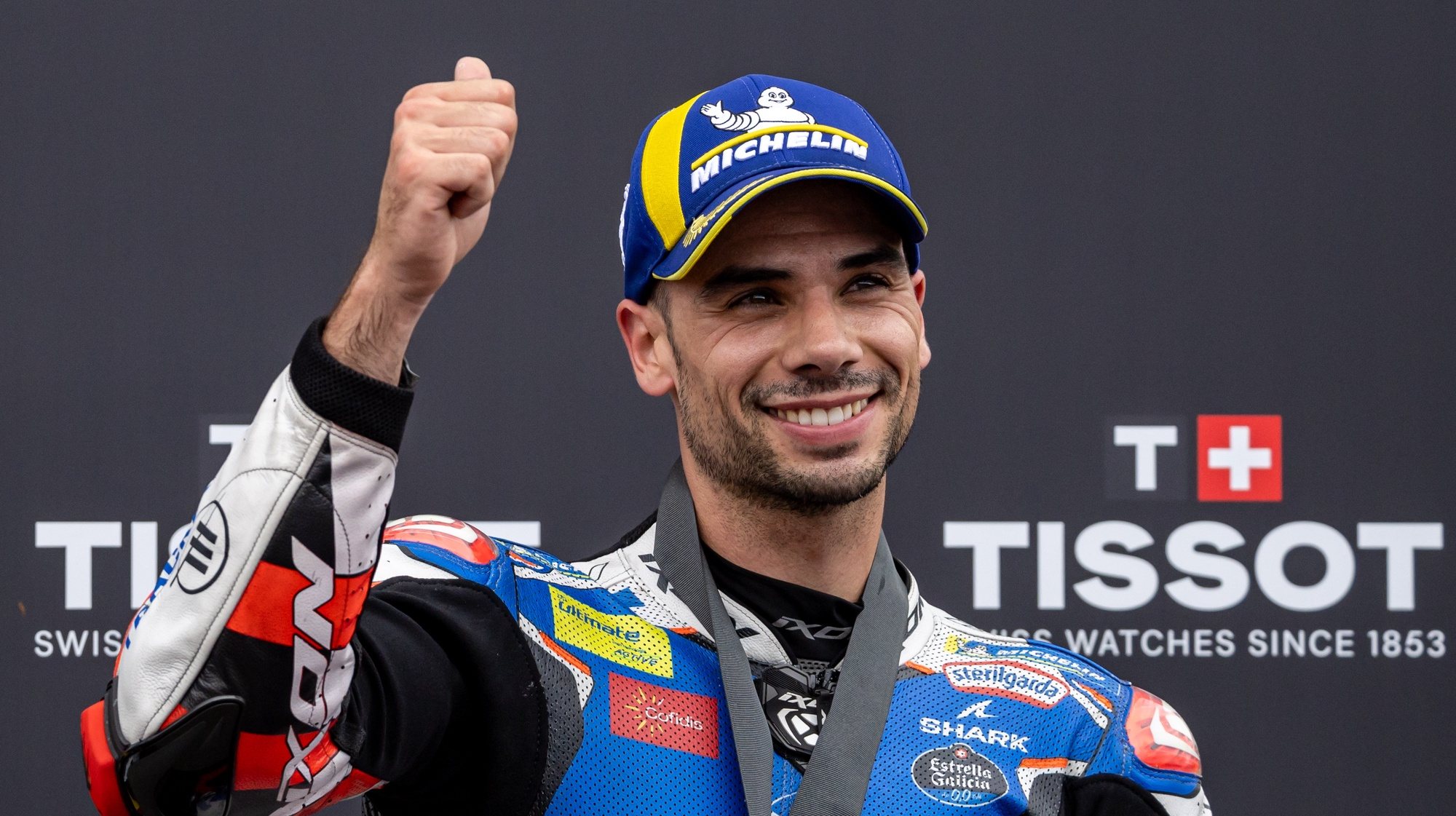 epa11462234 Second placed Trackhouse rider Miguel Oliveira of Portugal  celebrates after the MotoGP Sprint race of the Motorcycling Grand Prix of Germany, at the Sachsenring racetrack in Hohenstein-Ernstthal, Germany, 06 July 2024. The 2024 Motorcycling Grand Prix of Germany is held on the Sachsenring racetrack on 07 July.  EPA/MARTIN DIVISEK
