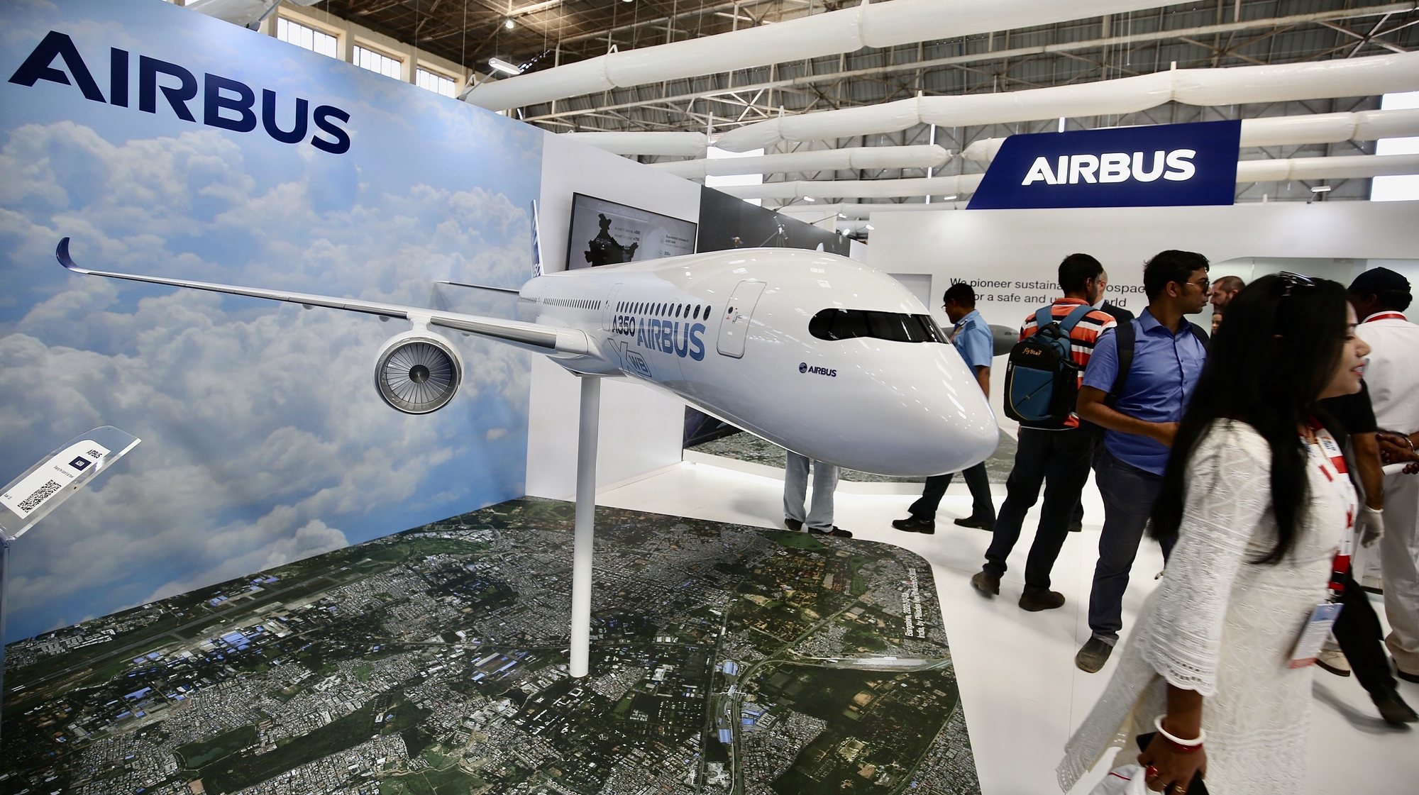 epa10468364 Visitors get information at the &#039;Airbus&#039; exhibition stall during the day-three of the 14th Edition of Aero India 2023, at the Yelahanka Air Force Base, in Bangalore, India, 15 February 2023. More than 800 international defense and aerospace Companies have participated in the Asia’s largest Aero India event which showcases warfare equipment including new fighter planes, next-generation submarines, warships, helicopters, missiles, howitzers, air defense systems, assault weapons and all kind of military gear from 13 to 17 February 2023.  EPA/JAGADEESH NV