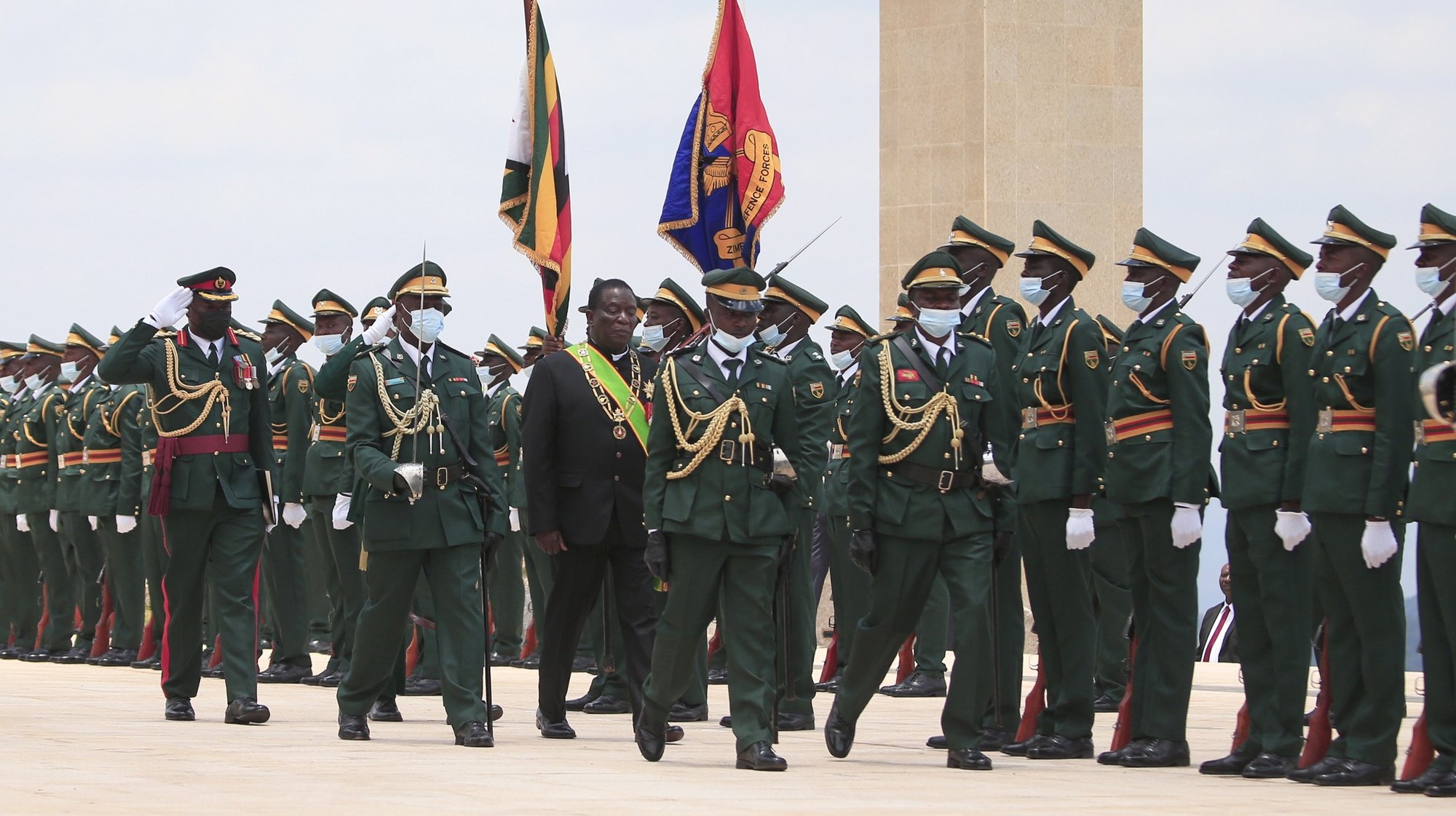 epa10323278 Zimbabwean President Emmerson Mnangagwa inspect the guard of honor before delivering the State of The Nation Address and officially open the fifth session of the Ninth Parliament in the newly built Parliament building in Mount Hampden, Zimbabwe, 23 November 2022.  EPA/AARON UFUMELI