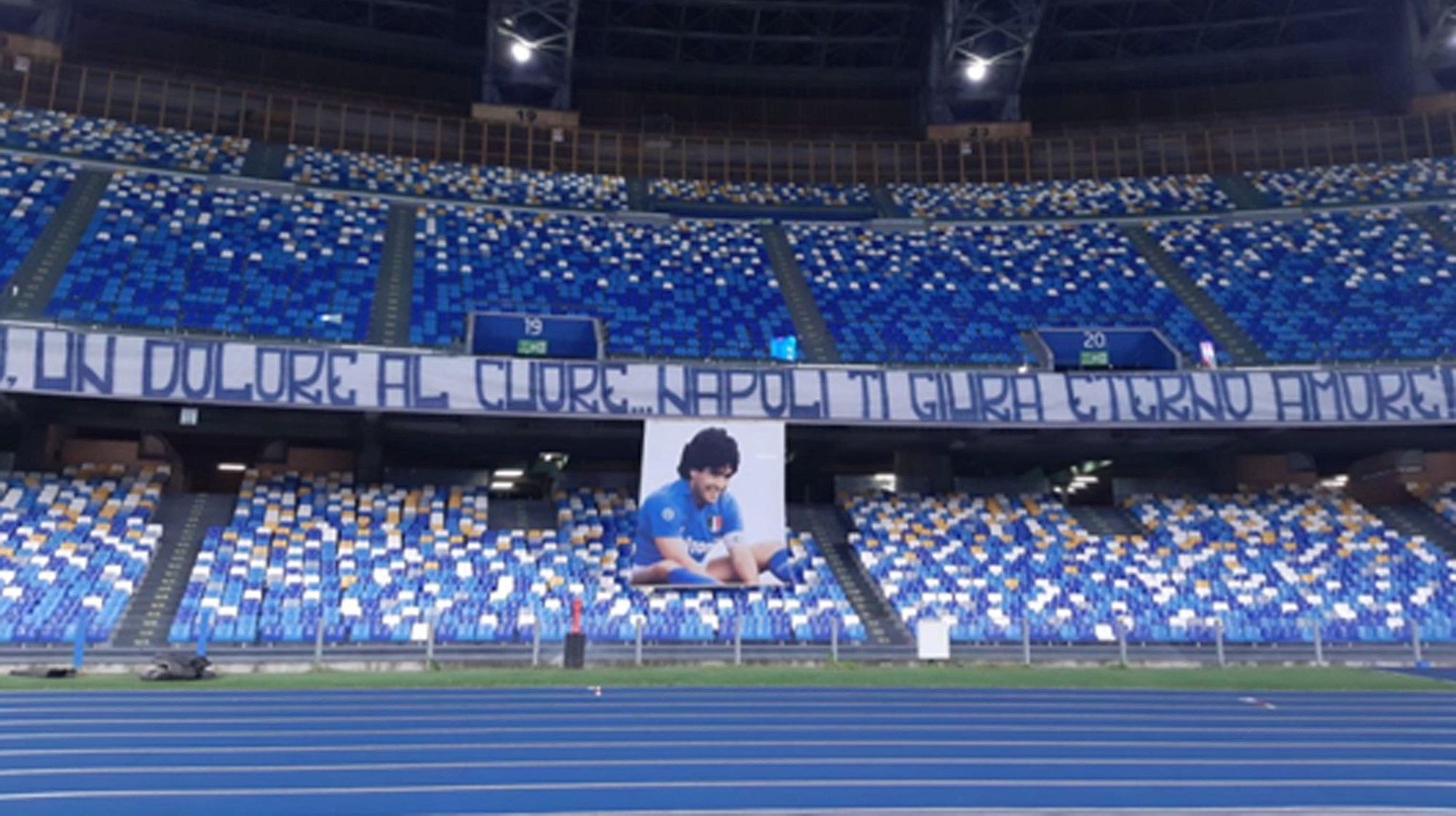 epa08851831 A banner displayed at the San Paolo stadium as a tribute to Diego Armando Maradona prior the Italian Serie A soccer match SSC Napoli vs AS Roma, Naples, Italy,  29 November 2020.  Maradona who played for Napoli died on 25 November 2020 aged 60.  EPA/CIRO FUSCO