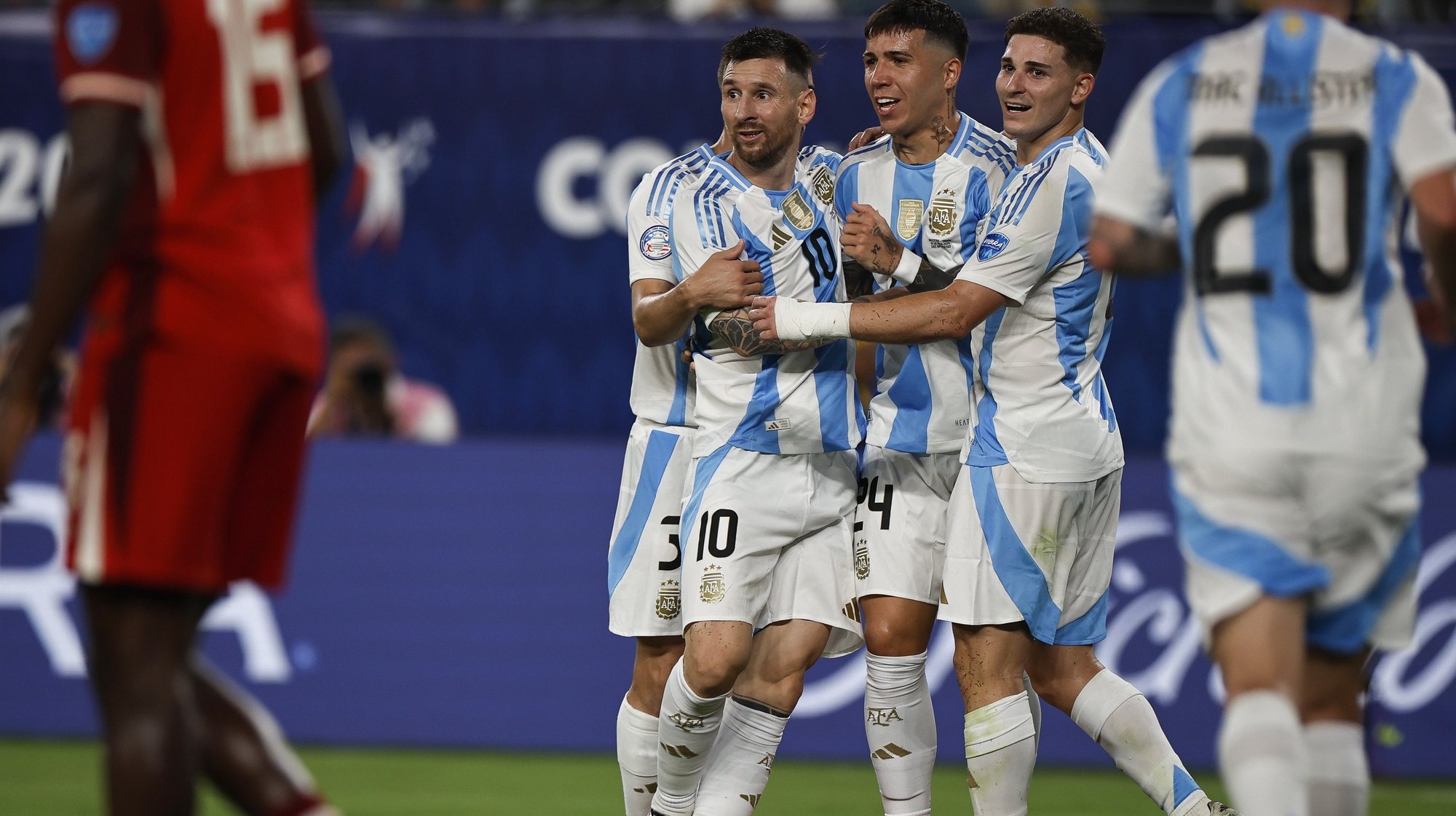 epa11469628 Lionel Messi of Argentina (C) is congratulated by teammates after scoring a goal against Canada during the CONMEBOL Copa America 2024 Semi-finals match between Argentina and Canada, in East Rutherford, New Jersey, USA, 09 2024.  EPA/CJ GUNTHER