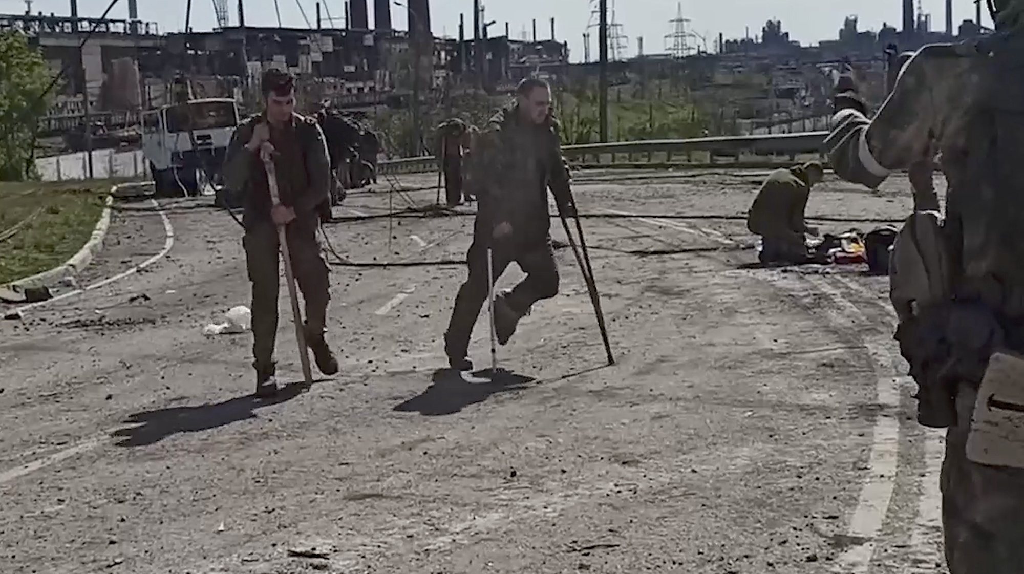 epa09956602 A still image taken from a handout video dated 17 Apirl 2022 and made available by the Russian Defence ministry press service on 18 April 2022 shows Ukrainian servicemen from the besieged Azovstal steel plant preparing to be evacuated, Mariupol, Ukraine, 17 May 2022. A total of 265 Ukrainian militants, including 51 seriously wounded, have laid down arms and surrendered to Russian forces, the Russian Ministry of Defence said on 17 May 2022. Those in need of medical assistance were sent for treatment to a hospital in Novoazovsk, the ministry states further. Russian President Putin on 21 April 2022 ordered his Defence Minister to not storm but to blockade the plant where a number of Ukrainian fighters were holding out. On 24 February, Russian troops invaded Ukrainian territory starting a conflict that has provoked destruction and a humanitarian crisis. According to the UNHCR, more than six million refugees have fled Ukraine, and a further 7.7 million people have been displaced internally within Ukraine since.  EPA/RUSSIAN DEFENCE MINISTRY PRESS SERVICE/HANDOUT HANDOUT HANDOUT EDITORIAL USE ONLY/NO SALES HANDOUT EDITORIAL USE ONLY/NO SALES