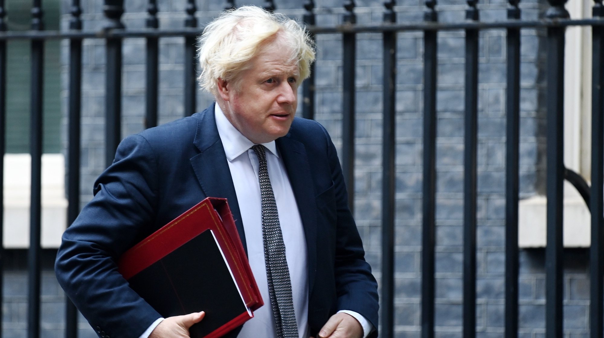 epa09427556 British Prime Minister Boris Johnson departs 10 Downing Street in London, Britain, 24 August 2021. Johnson is set to push US President Biden for a troop withdrawal extension in Afghanistan during an emergency G7 virtual summit meeting scheduled for 24 August.  EPA/ANDY RAIN