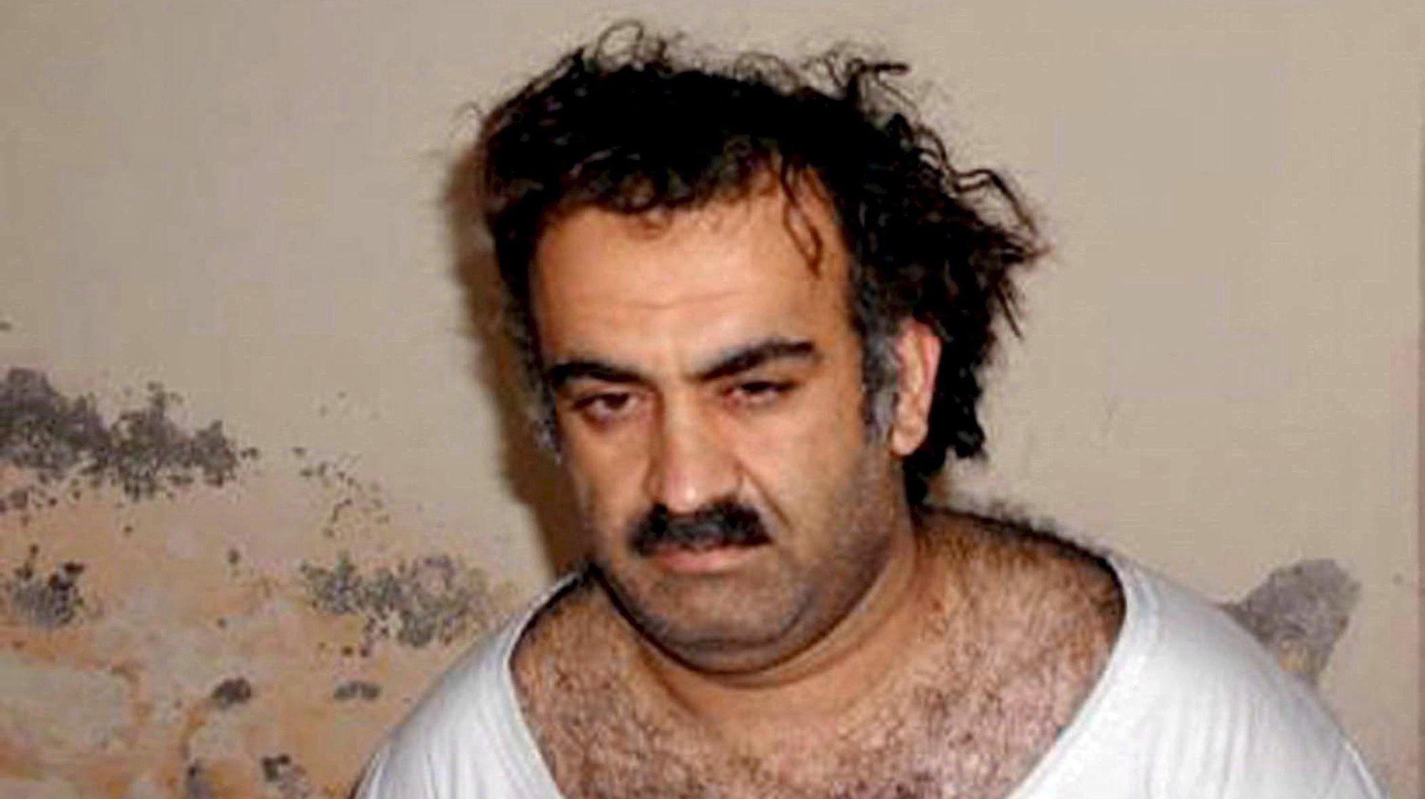 epa03206657 (FILE) A handout photo obtained 01 March 2003, showing Al-Qaeda operative Khalid Sheikh Mohammed shortly after his capture, in Rawalpindi, Pakistan. A group of five alleged terrorists, Ramzi Binalshibh, Ali Abdul Aziz Ali, Mustafa Ahmed al-Hawsawi and Walid bin Attas, led by alleged mastermind Khalid Sheikh Mohammed are to appear before a military tribunal in Guantanamo 05 May 2012 to hear the charges against them. According to the Pentagon, the charges related to 11 September 2001 terrorist attacks in USA include terrorism, hijacking aircraft, conspiracy, murder, attacking civilians, intentionally causing serious bodily injury and destruction of property.  EPA/HANDOUT  HANDOUT EDITORIAL USE ONLY/NO SALES *** Local Caption *** 00000402670123
