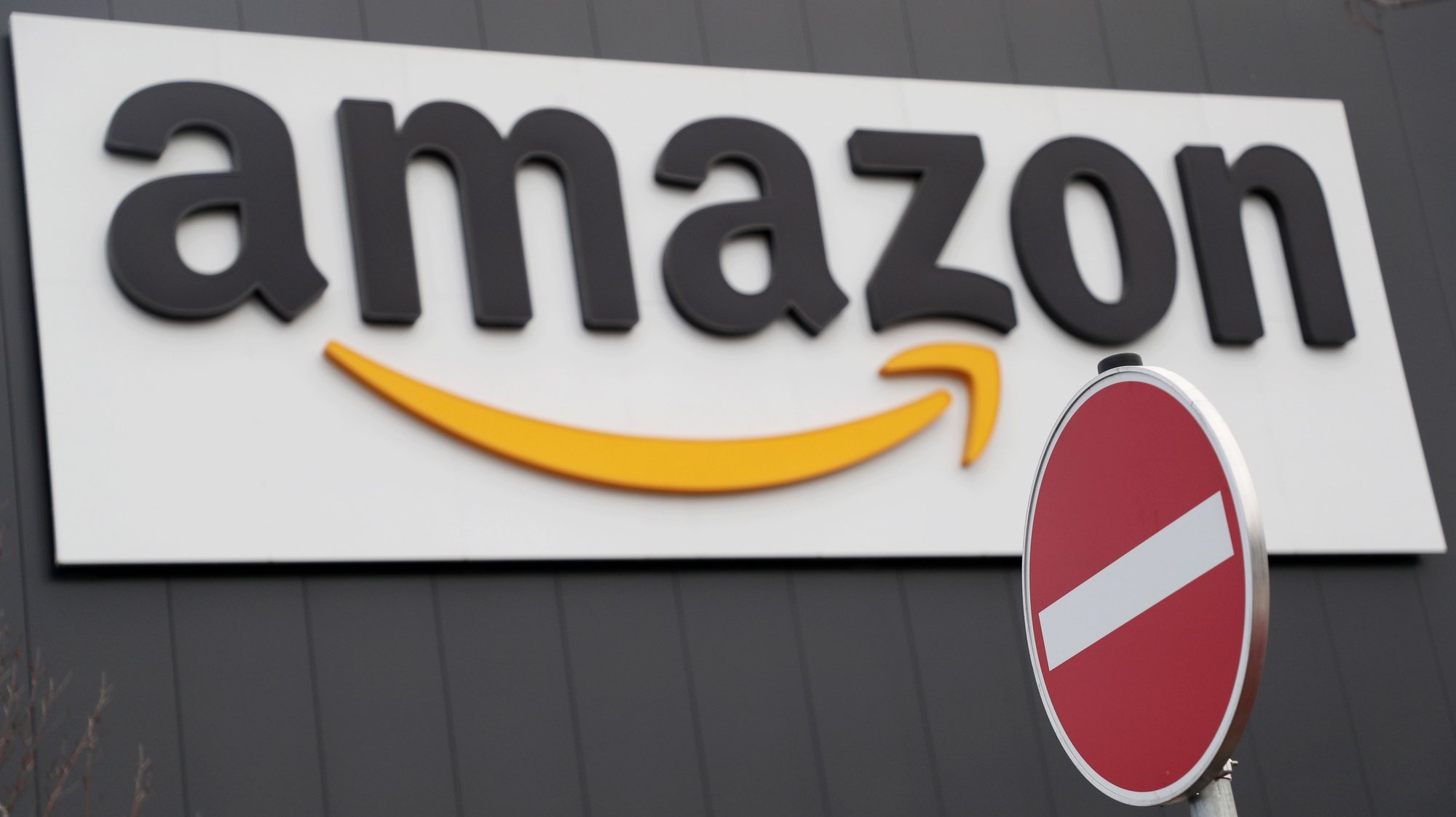 epa08478451 (FILE) - The Amazon logo is pictured outside the company&#039;s logistic and distribution center in Werne, Germany, 22 November 2018 (reissued 10 June 2020). Amazon Web Services (AWS) announced on 10 June that it will ban cops from using its facial recognition technology &#039;Amazon Rekognition&#039; for one year, in wake of the ongoing protests against police abuse following the death of George Floyd in Minneapolis, Minnesota.  EPA/FRIEDEMANN VOGEL