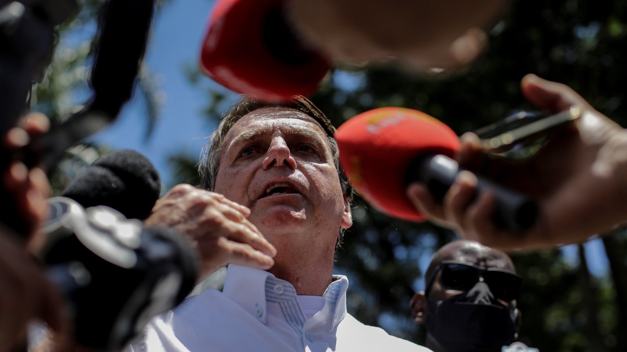 epa08851519 Brazilian President Jair Bolsonaro makes a statement after voting during the second round of Municipal elections at a polling station in Rio de Janeiro, Brazil, 29 November 2020. Brazil is holding the second round of municipal elections in the country on 29 November.  EPA/ANTONIO LACERDA