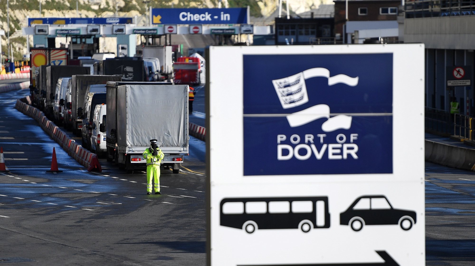 epa08902586 Freight trucks and other vehicles make their way through the Port of Dover in Dover, Britain, 24 December 2020. Dover Port has reopened its border after France closed its border with Britain for 48 hours over concerns about the new coronavirus variant. Lorry drivers must now obtain negative coronavirus tests before they will be allowed to cross by sea and the Port of Dover remains closed to outbound traffic on the morning of 23 December 2020.  EPA/ANDY RAIN