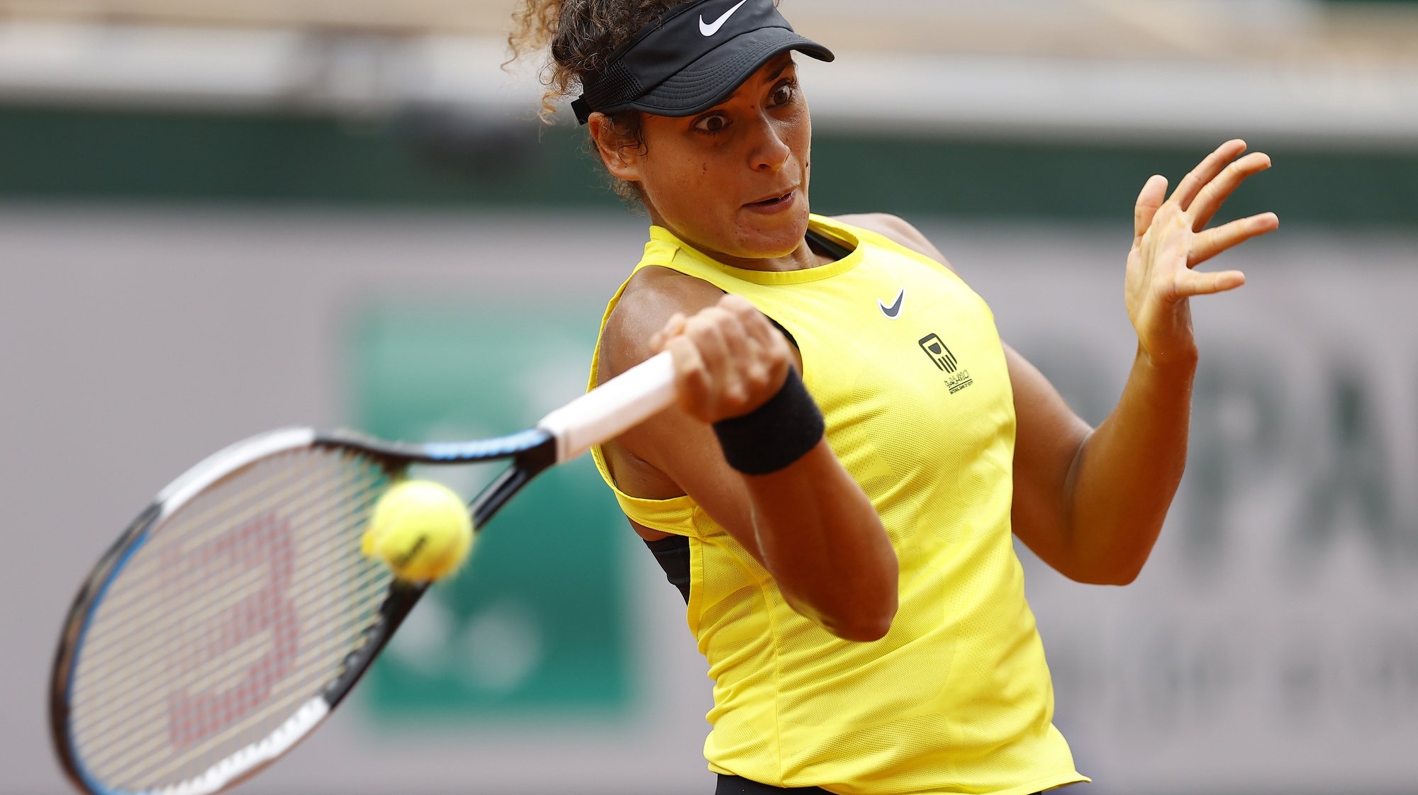epa08705377 Mayar Sherif of Egypt hits a forehand during her first round match against Karolina Pliskova at the French Open tennis tournament at Roland Garros in Paris, France, 29 September 2020.  EPA/IAN LANGSDON