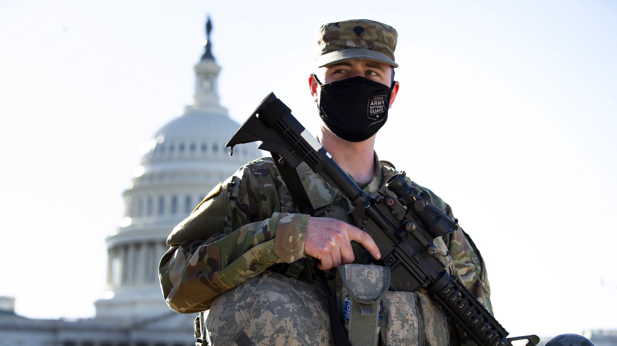 epaselect epa09050137 A member of the National Guard stands at the East Front of the US Capitol in Washington, DC, USA, 03 March 2021. Capitol Police said they have received intelligence that shows a possible plot by a militia group to breach the Capitol on 04 March. Right-wing conspiracy theorists believe 04 March is a day that former US President Trump will regain the presidency.  EPA/MICHAEL REYNOLDS
