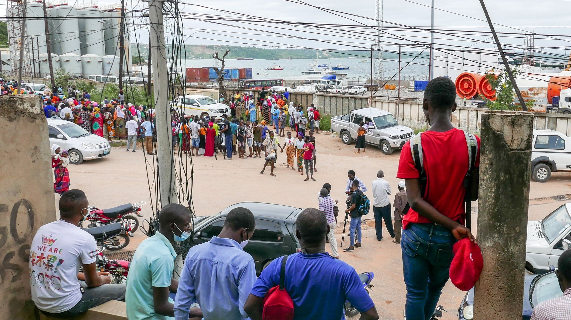 People wait at the port of Pemba for the arrival of a boat with 1200 displaced people coming from Palma, in Pemba, Mozambique, 01 April 2021. It is the largest single arrival in Pemba of displaced civilians, population of Palma. LUIS MIGUEL FONSECA/LUSA