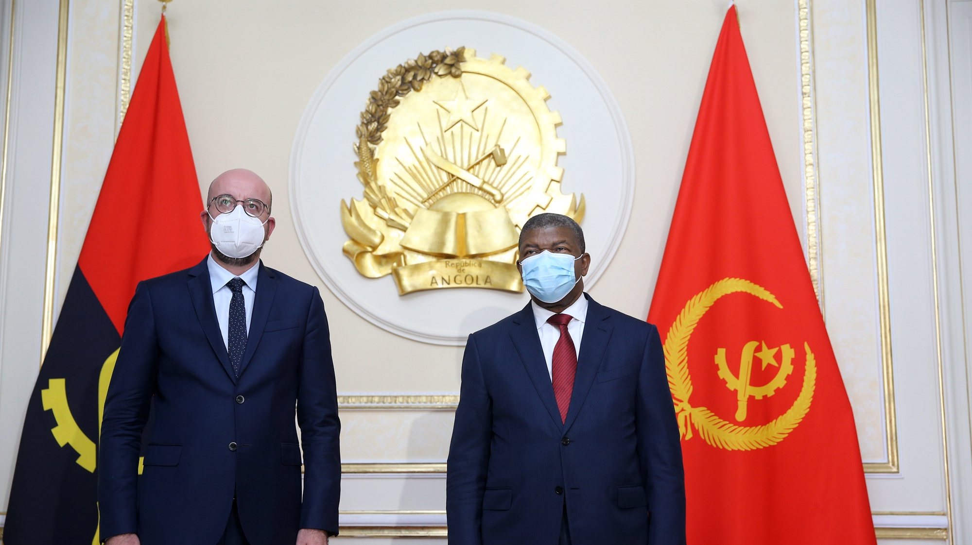 President of the European Council Charles Michel (L) is welcomed by the President of Angola Joao Lourenco (R) moments before a meeting at Presidential Palace in Luanda, Angola, 30 April 2021. AMPE ROGERIO/LUSA