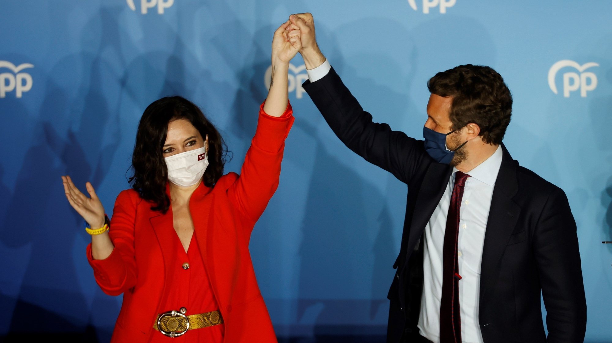 epa09177947 Madrid&#039;s regional president and candidate to reelection Isabel Diaz Ayuso (L) and People&#039;s Party Part Leader Pablo Casado react as they wait for Madrid&#039;s regional elections results closing to the party&#039;s headquarters in Madrid, central Spain, 04 May 2021. Isabel Diaz Ayuso could be reelected with between 62 and 65 deputies but would need the support of far-right Vox to form a governmet, according Spanish media.  EPA/Mariscal