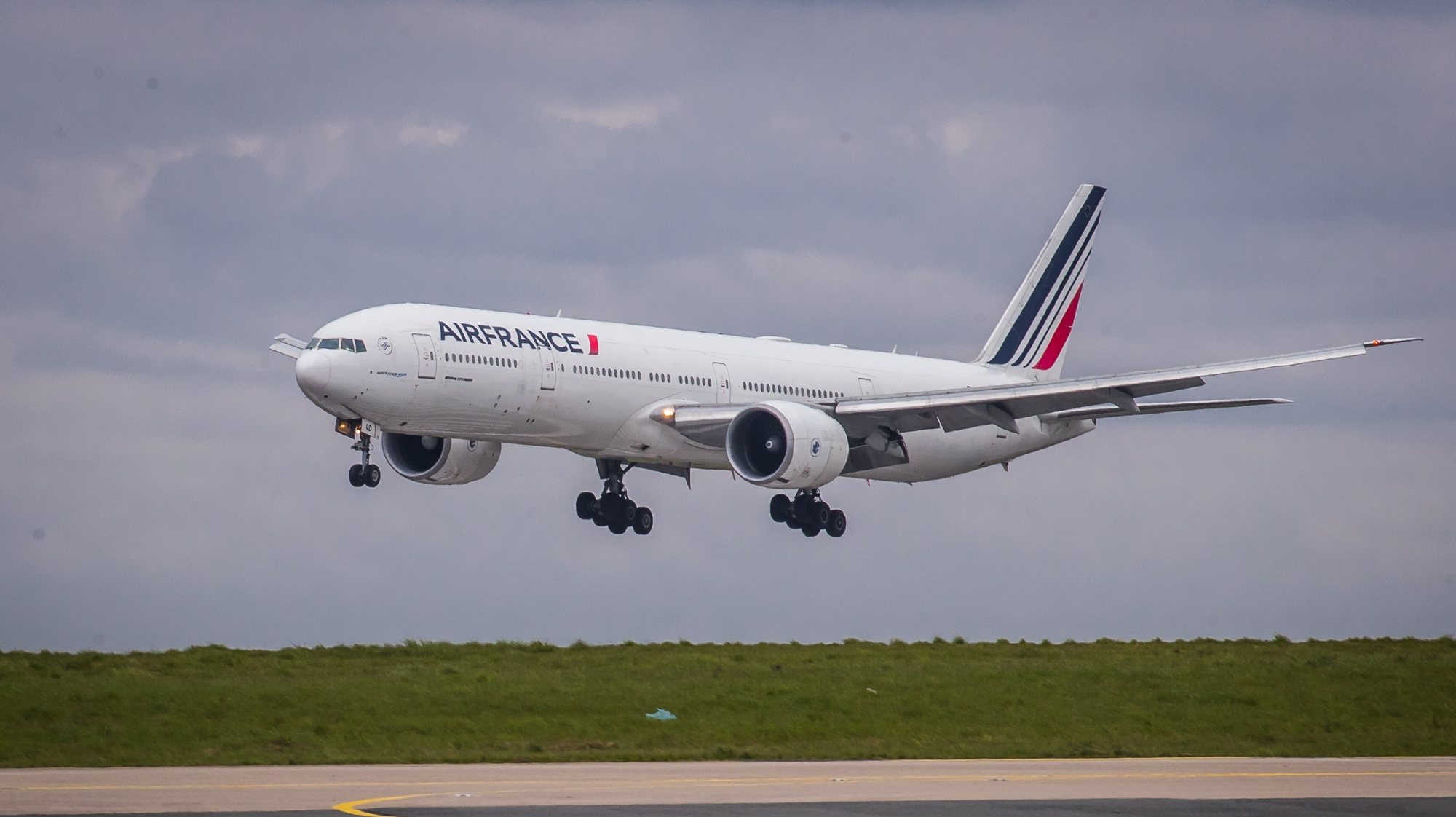 epa09130188 An Air France Boeing 777 take-off at Roissy Airport, near Paris, 11 April 2021 (issued 12 April 2021). Airline company Air France KLM Cargo, operated two flies to Cameroon and Colombia with a shipment of Chinese covid19 vaccines SinoPharm and SinoVac through its cargo area of Roissy airport (CDG).  EPA/CHRISTOPHE PETIT TESSON