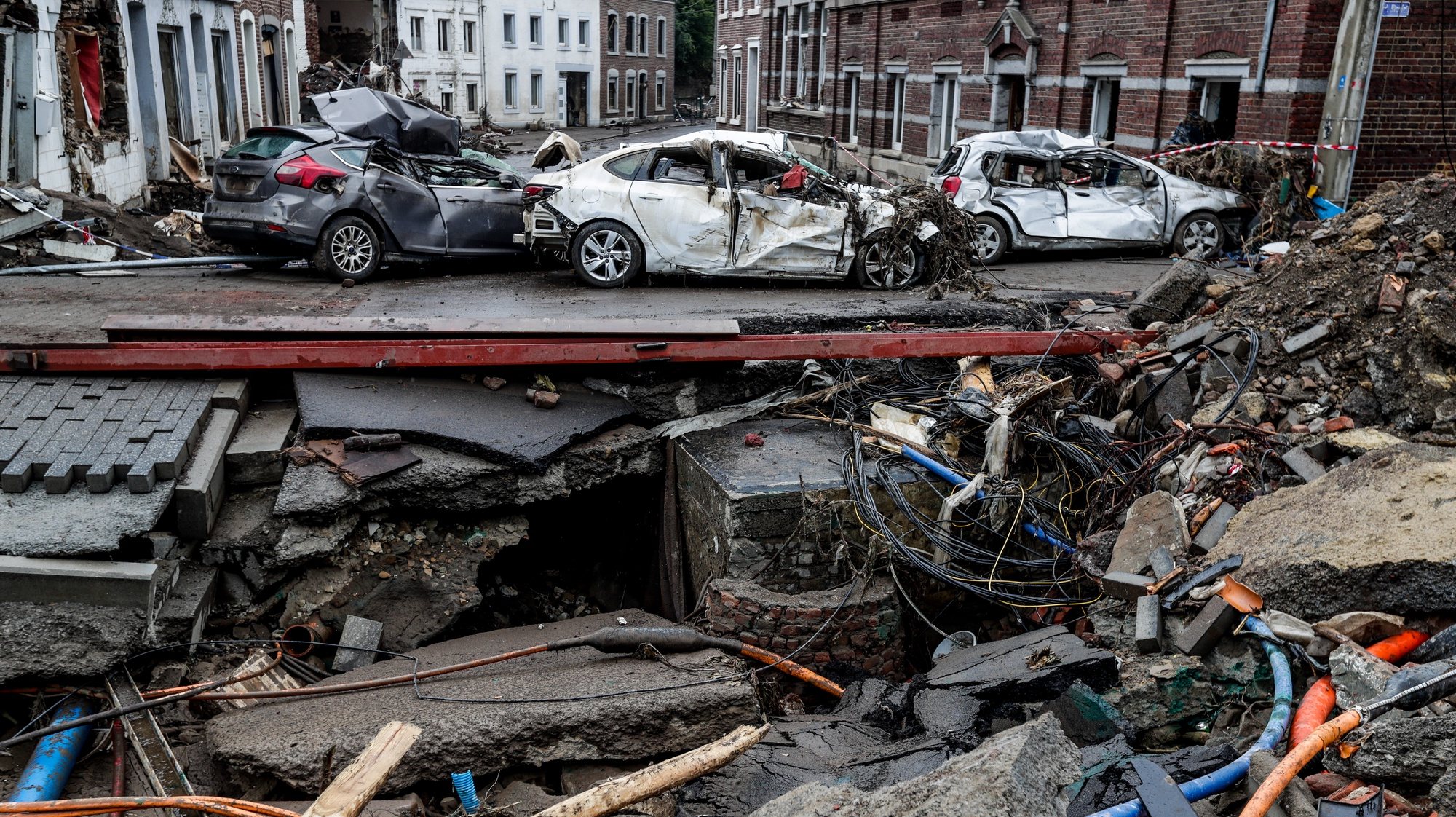 epaselect epa09362387 A view of damaged cars in Pepinster, Belgium, 24 July 2021. Heavy rains caused widespread damage and flooding in parts of Belgium and across central Europe in the night of 14/15 July. Dozens have died and many remain unaccounted for.  EPA/STEPHANIE LECOCQ