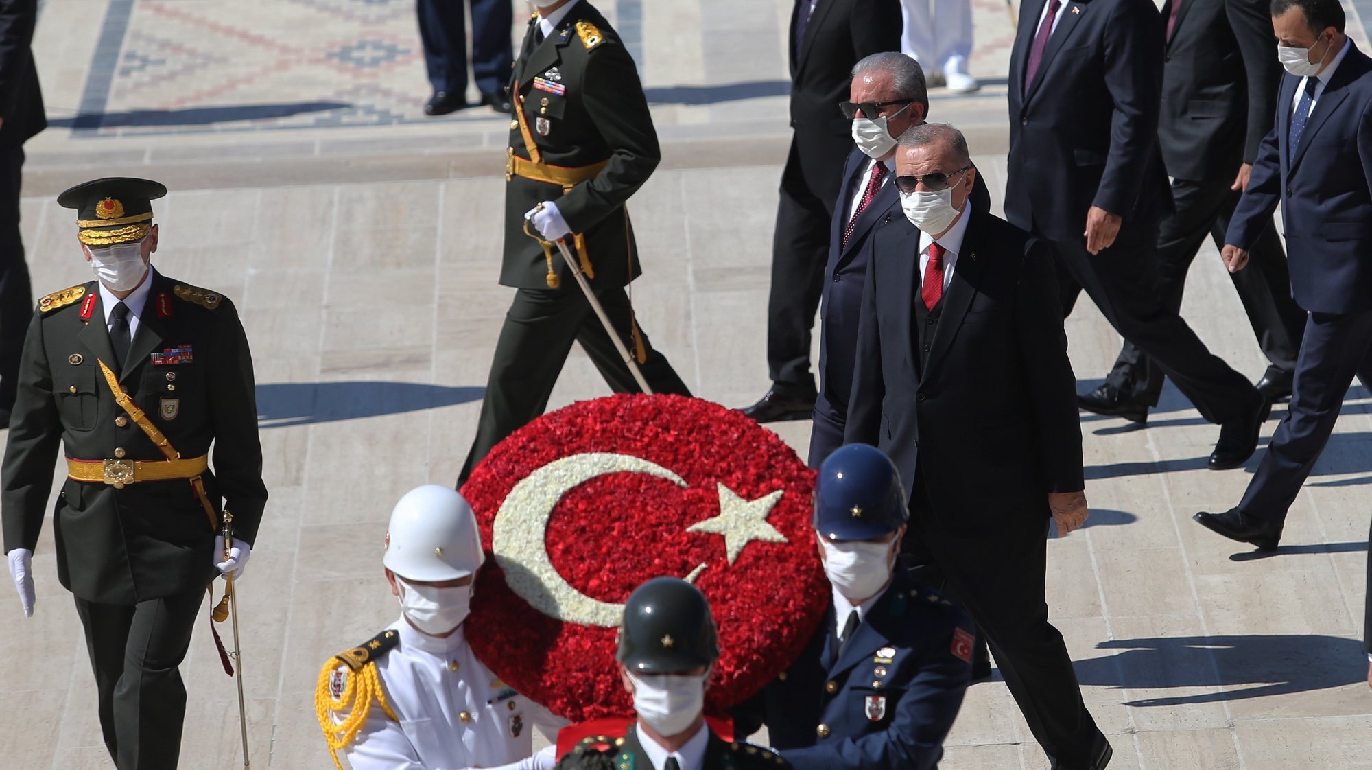 epa08635648 Turkish President Recep Tayyip Erdogan (C) and Turkish Grand National Assembly (TBMM) Speaker Mustafa Sentop (C-L) attend wreath laying ceremony at the Mausoleum of Mustafa Kemal Ataturk, founder of the modern Turkey, during a parade to mark Victory Day in Ankara, Turkey, 30 August 2020. Turkey celebrates its Victory Day in commemoration of the Battle of Dumlupinar, a key victory over Greece on 30 August 1922 in Turkey&#039;s War of Independence.  EPA/STR