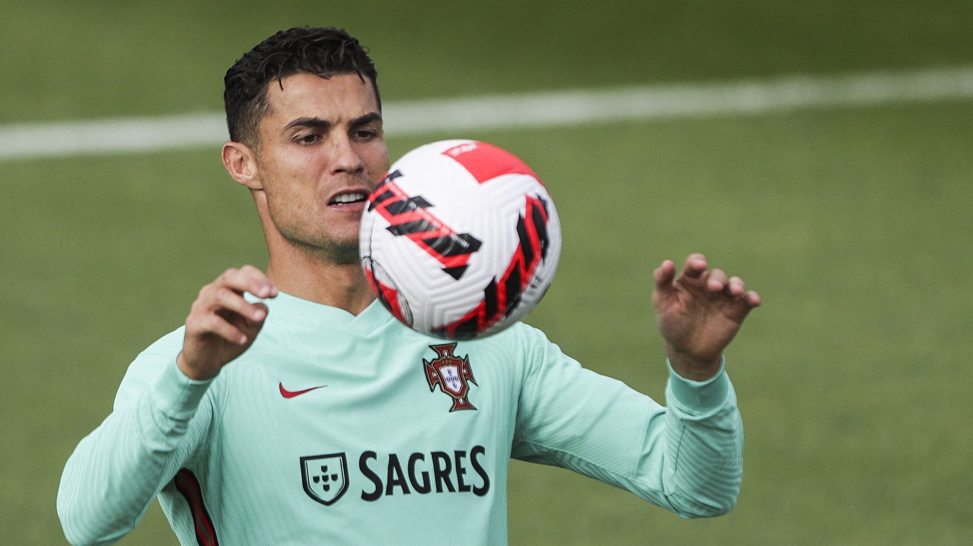 epa09507688 Portuguese soccer player Cristiano Ronaldo in action during Portugal´s national team training session at Oeiras, outskirts of Lisbon, Portugal, 05 October 2021.  EPA/TIAGO PETINGA