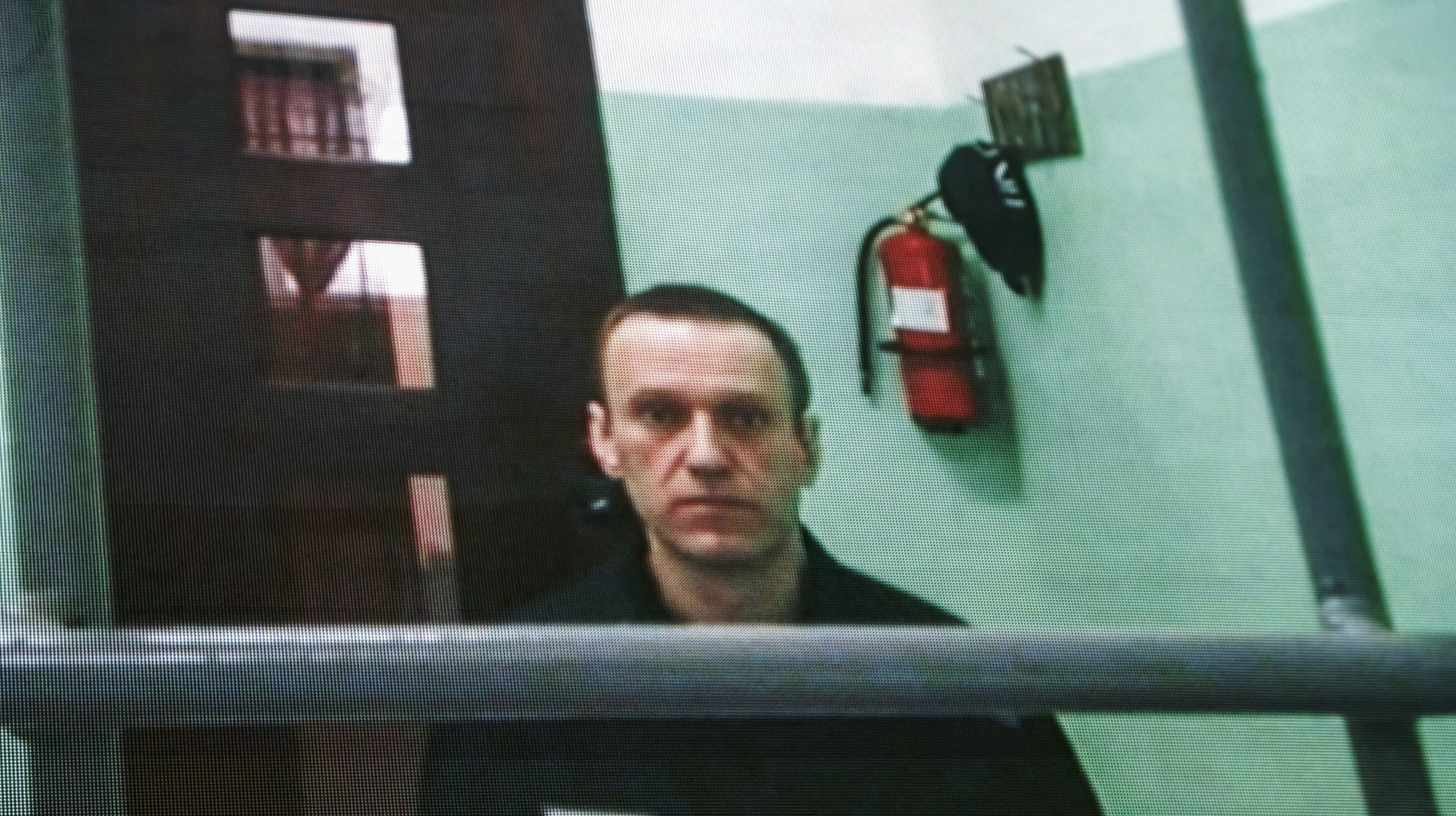 epa10705289 Russian opposition figure Alexei Navalny is seen on a screen via a video link from his penal colony during a hearing about his right to correspond while in jail, at the Russian Supreme court in Moscow, Russia, 22 June 2023.  The Supreme Court of the Russian Federation recognized as lawful the internal regulations of correctional institutions on the issuance of writing materials to persons held in punishment cells. Navalny has been in the colony since February 2021, when the court, at the request of the Federal Penitentiary Service, replaced his suspended sentence in the Yves Rocher case of 2014 with a real one. He was supposed to serve in a penal colony for 2 years and 8 months, but in March 2022, the Lefortovo Court of Moscow, at an off-site meeting in correctional colony-2 in the city of Pokrov, Vladimir Region, sentenced the politician to 9 years of strict regime and a fine of 1.2 million rub., as well as one and a half years of restriction of freedom in the case of fraud and contempt of court. In June 2022, the sentence entered into force.  EPA/SERGEI ILNITSKY