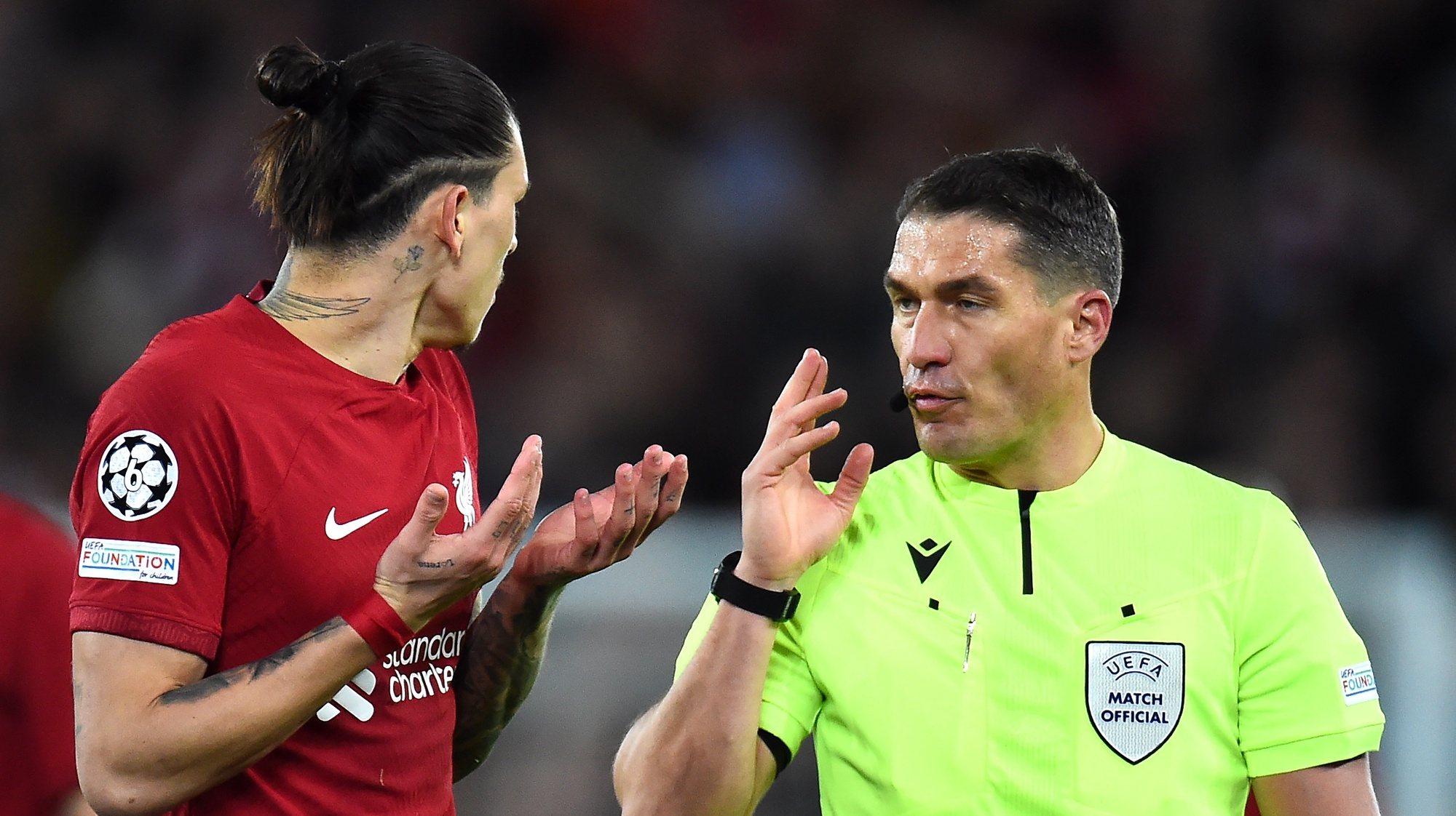 epa10482656 Referee Istvan Kovacs talks to Darwin Nunez of Liverpool during the UEFA Champions League, Round of 16, 1st leg match between Liverpool FC and Real Madrid in Liverpool, Britain, 21 February 2023.  EPA/Peter Powell