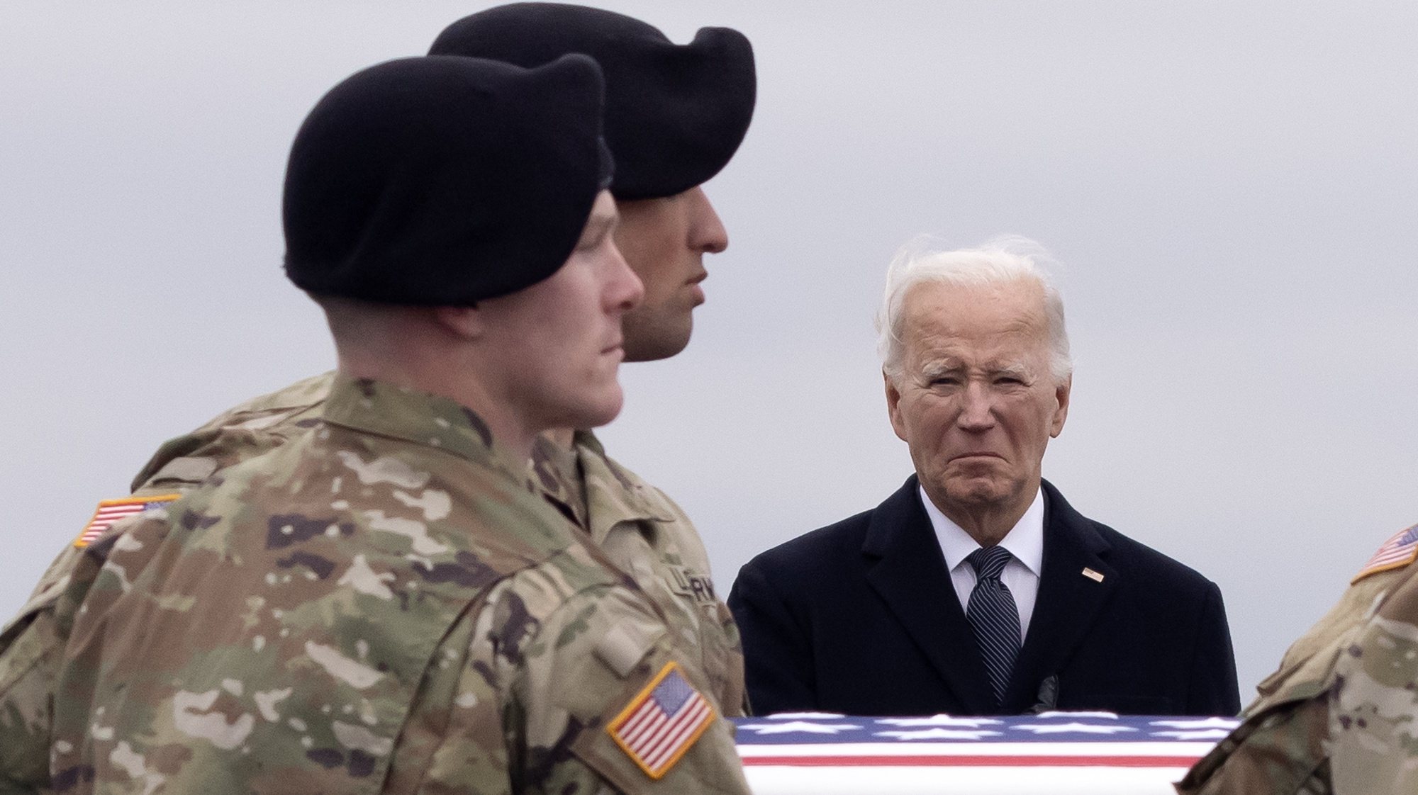 epa11121741 US President Joe Biden (R) watches as a US Army carry team moves a flag-draped transfer case containing the remains of US Army Sergeant Jerome Rivers, during a dignified transfer of fallen US service members, at Dover Air Force Base in Dover, Delaware, USA, 02 February 2024. US Army Sergeant Jerome Rivers. US Army Sergeant Breonna Moffett, and US Army Sergeant Kennedy Sanders died in a drone strike on 28 January at a military base in Jordan; forty other US troops were also injured in the attack. The enemy drone, which the White House has blamed on an Iran-backed militia, may have been mistaken for a US drone and left unimpeded, according to a preliminary report.  EPA/MICHAEL REYNOLDS