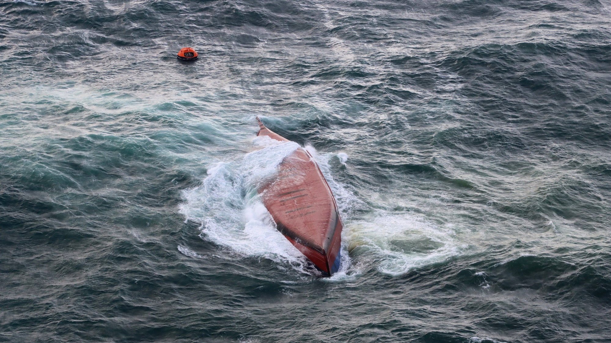 epa11230639 A handout photo made available by the Moji Coast Guard Office shows the South Korean-flagged chemical tanker, Keoyoung Sun, after it capsized off the coast of Shimonoseki, Yamaguchi Prefecture, western Japan, 20 March 2024. According to the Japan Coast Guard, nine of the 11 crew members were rescued by helicopter, of whom seven were later confirmed dead. Rescuers are still searching for two missing members.  EPA/MOJI COAST GUARD OFFICE HANDOUT  HANDOUT EDITORIAL USE ONLY/NO SALES HANDOUT EDITORIAL USE ONLY/NO SALES