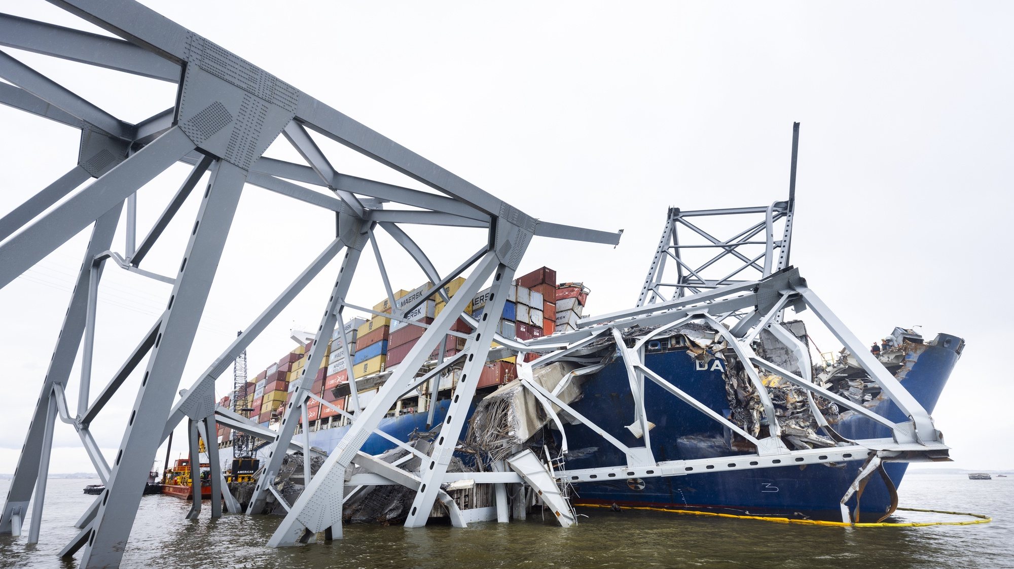 epa11259526 Steel beams from the collapsed Francis Scott Key Bridge lie across the 984-foot cargo ship Dali in Baltimore, Maryland, USA, 04 April 2024. Demolition crews have begun work to remove the first pieces of bridge wreckage from the Patapsco River. Two people were rescued, two recovered dead, and four are still missing and presumed dead from the collapse at the bridge that occurred when it was struck by the cargo vessel Dali on 26 March 2024.  EPA/JIM LO SCALZO