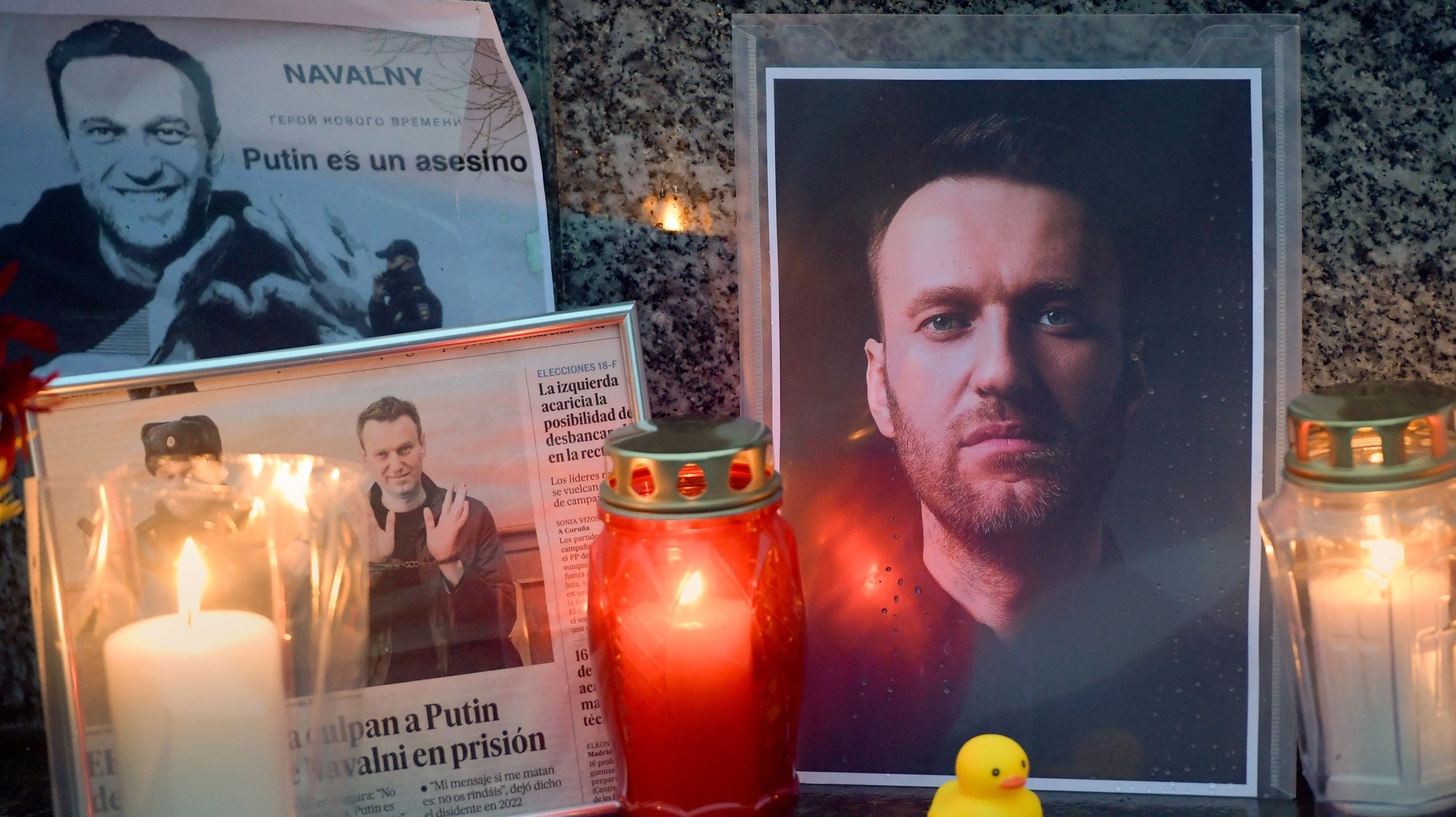 epaselect epa11192155 Candles are placed next to photos of Russian opposition leader Alexei Navalny in Gijon, Asturias, northern Spain, 01 March 2024. Outspoken Kremlin critic Navalny died aged 47 in an arctic penal colony on 16 February 2024 after being transferred there in 2023. The colony is considered to be one of the world&#039;s harshest prisons.  EPA/Eloy Alonso