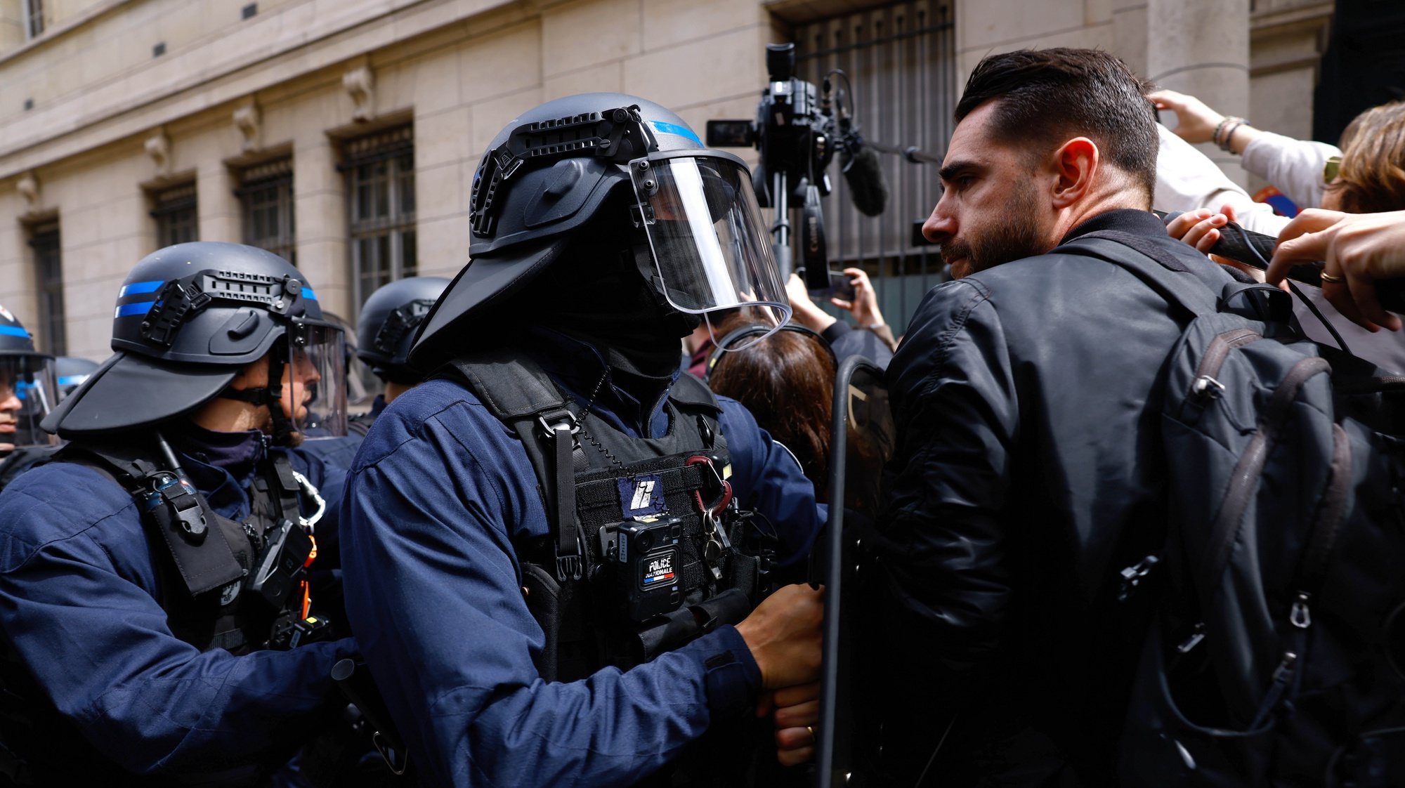 epa11308369 Pro-Palestinian demonstrators face French police forces as they gather outside the Sorbonne University, where they tried to set up a protest camp before being evacuated by police in Paris, France, 29 April 2024. More than 34,300 Palestinians and over 1,455 Israelis have been killed, according to the Palestinian Health Ministry and the Israel Defense Forces (IDF), since Hamas militants launched an attack against Israel from the Gaza Strip on 07 October 2023, and the Israeli operations in Gaza and the West Bank which followed it.  EPA/MOHAMMED BADRA