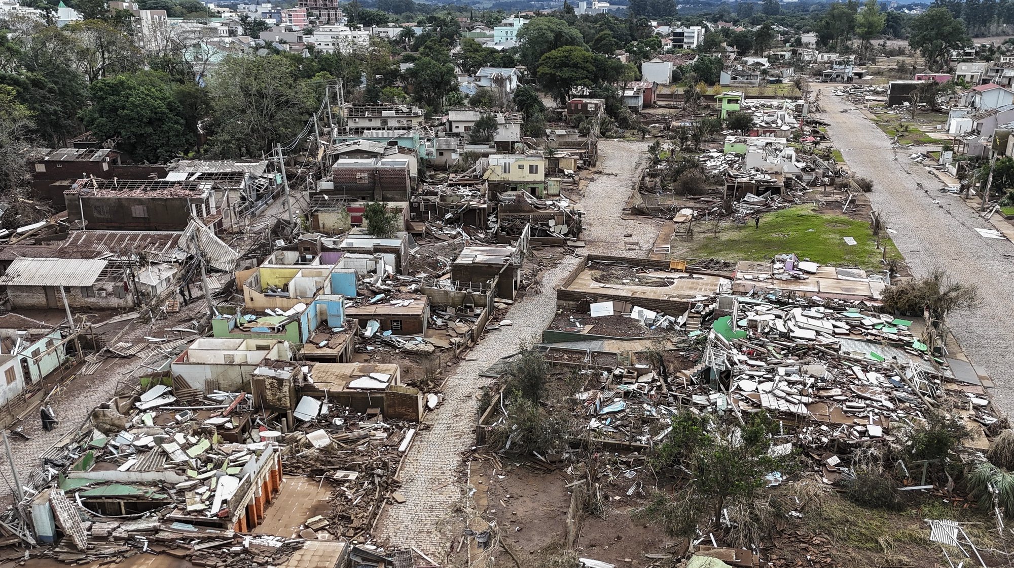 epa11329823 A photo taken with a drone shows the destruction following floods after the overflowing of the Forqueta River in Lajeado, Brasil, 09 May 2024. At  least 108 people died and more than 130 were still missing, as heavy rains and floods hit southern Brazil.  EPA/Sebastiao Moreira