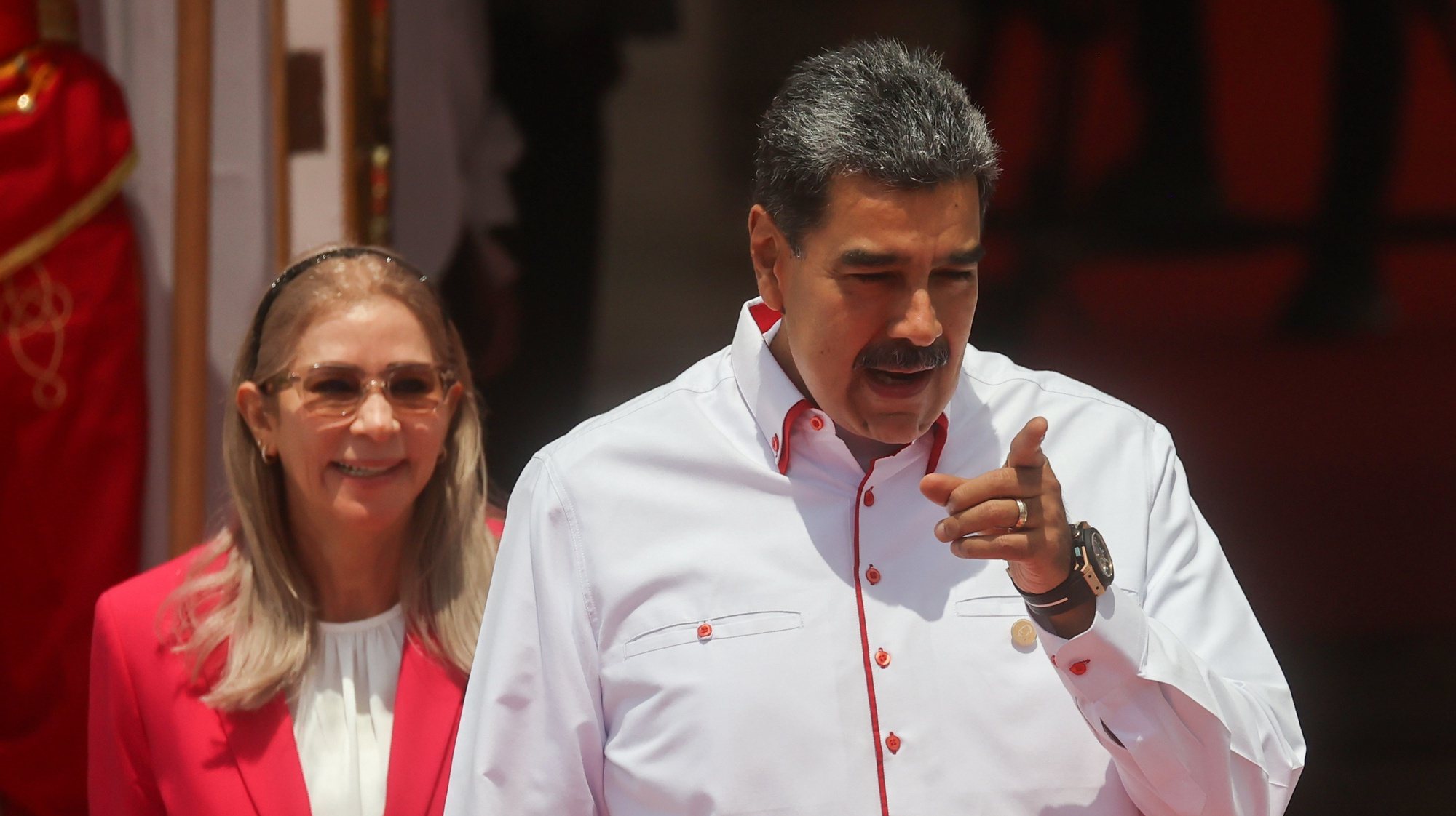 epa11298676 The president of Venezuela, Nicolas Maduro (C) prepares with the first lady Cilia Flores (L), to receive the leaders who will participate in the ALBA Summit at the Miraflores Palace, in Caracas, Venezuela, 24 April 2024. The XXIII Summit of the Bolivarian Alliance for the Peoples of Our America (ALBA) brings together in Caracas presidents of several bloc countries, among them, the Cuban Miguel Diaz-Canel, the Nicaraguan Daniel Ortega, and the Bolivian Luis Arce, who will meet with their Venezuelan counterpart Nicolas Maduro in a conclave in which they will address issues of common interest.  EPA/Miguel Gutierrez