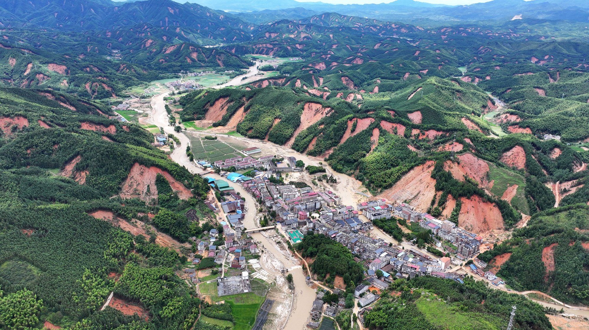 epa11510873 An aerial drone photo taken shows a view of the Bamianshan Yao Township, Zixing City, central China&#039;s Hunan Province, 30 July 2024 (issued 31 July 2024). Heavy rains in the aftermath of Typhoon Gaemi have toppled or damaged the homes of 867 households and caused 1,345 road cave-ins. Officials said that communications with many villages were disrupted, hindering timely updates on the situation.  EPA/XINHUA / Chen Zhenhai CHINA OUT / UK AND IRELAND OUT  /       MANDATORY CREDIT EDITORIAL USE ONLY