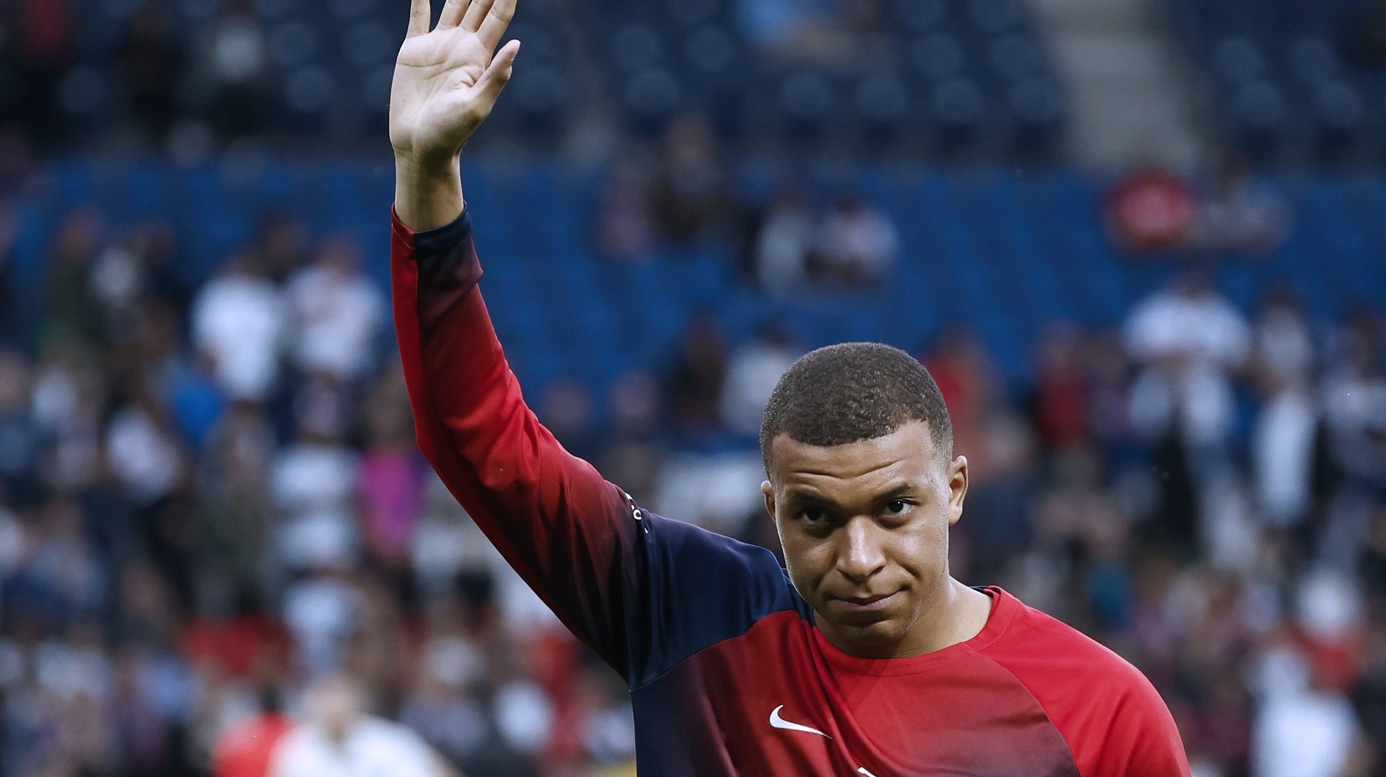 epa11336220 Kylian Mbappe of Paris Saint Germain gestures toward supporters prior to the French Ligue 1 soccer match between Paris Saint-Germain (PSG) and Toulouse (TFC) in Paris, France, 12 May 2024.  EPA/MOHAMMED BADRA