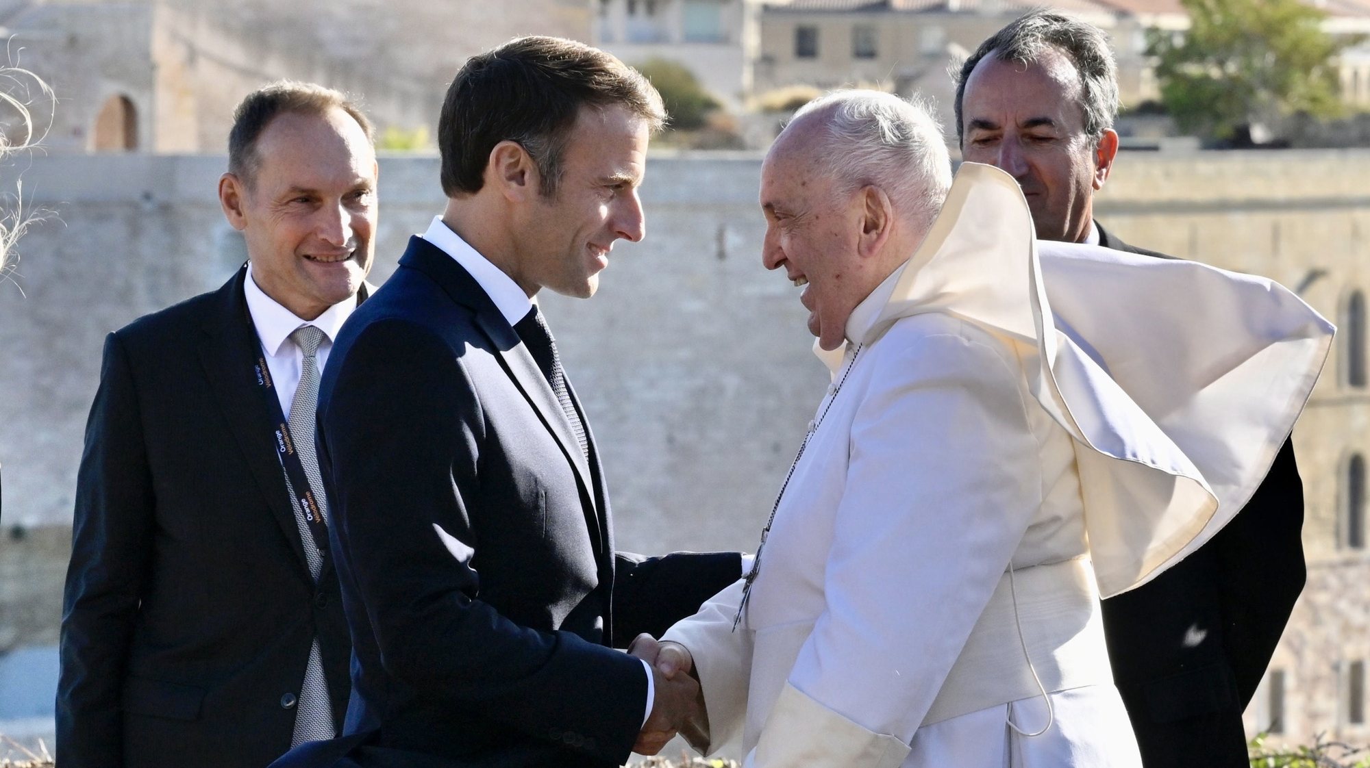 epa10878176 Pope Francis (R) is welcomed by the President of the French Republic Emmanuel Macron (L) upon his arrival for the final session of the Mediterranean Meetings, at the Palais du Pharo in Marseille, France, 23 September 2023. On the occasion of his apostolic journey in Marseille, Pope Francis will attend the conclusion of the Mediterranean Meetings that are held from 22 to 23 September.  EPA/ALESSANDRO DI MEO
