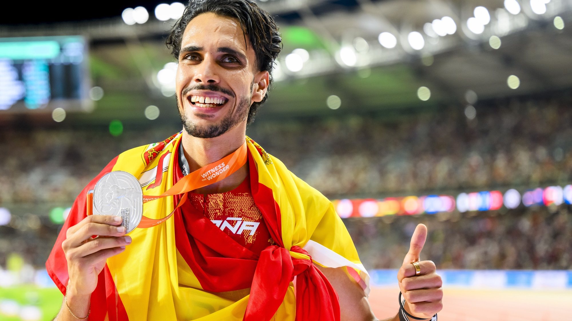 epa10824247 Silver medalist Mohamed Katir of Spain celebrates after the men&#039;s 5000 meters final of the World Athletics Championships at the National Athletics Centre, in Budapest, Hungary, 27 August 2023.  EPA/JEAN-CHRISTOPHE BOTT