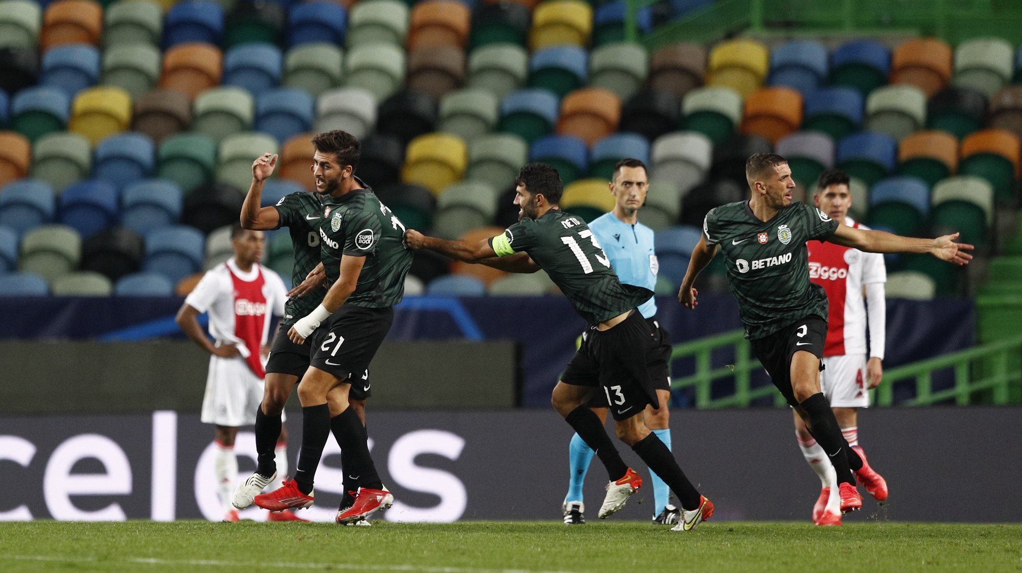 Sporting player Paulinho (L) celebrates after scoring a goal against Ajax during their UEFA Champions League Group C soccer match at Jose Alvalade Stadium in Lisbon, Portugal, 15 September 2021. ANTONIO COTRIM/LUSA