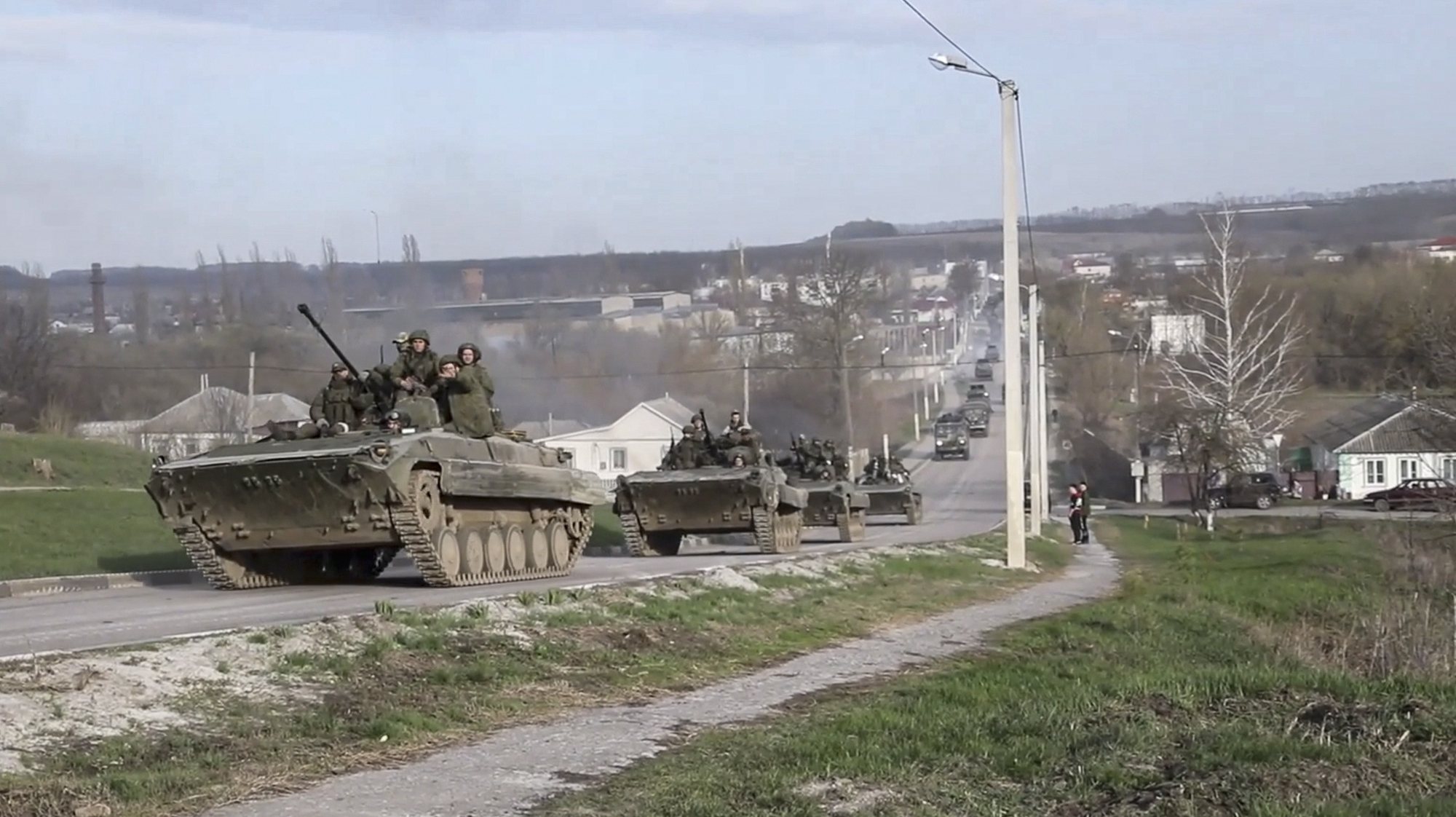 epa09902364 A handout still image taken from handout video made available by the Russian Defence ministry press-service shows Russian servicemen drive on their armoured personnel carrier (APC) during Russian offensive operation in Kharkiv region, Ukraine, 22 April 2022. On 24 February Russian troops had entered Ukrainian territory in what the Russian president declared a &#039;special military operation&#039;, resulting in fighting and destruction in the country, a huge flow of refugees, and multiple sanctions against Russia.  EPA/RUSSIAN DEFENCE MINISTRY PRESS SERVICE/HANDOUT  HANDOUT EDITORIAL USE ONLY/NO SALES