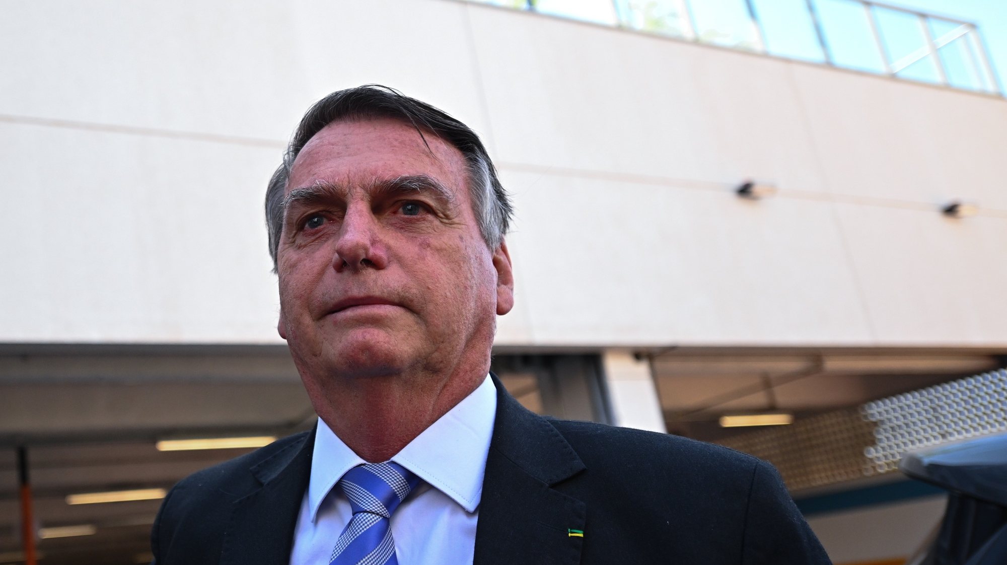 epa10926182 Former Brazilian president Jair Bolsonaro leaves the Federal Police headquarters after testifying in the case of several businessmen who allegedly supported the 2023 Brazilian Congress attack, in Brasilia, Brazil, 18 October 2023. The parliamentary commission on the 08 January 2023 coup attempt in Brazil began debating its final report, which accuses Bolsonaro of having conspired to try to overthrow the Government of progressive Luiz Inacio Lula da Silva.  EPA/Andre Borges