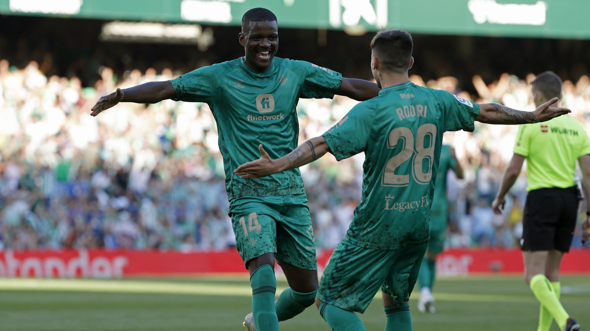 epa10574264 Betis&#039; midfielder William Carvalho (L) celebrates with teammate Rodrigo Sanchez (R) after scoring the 3-1 goal during the Spanish LaLiga soccer match between Real Betis and RCD Espanyol in Seville, southern Spain, 15 April 2023.  EPA/Julio Munoz
