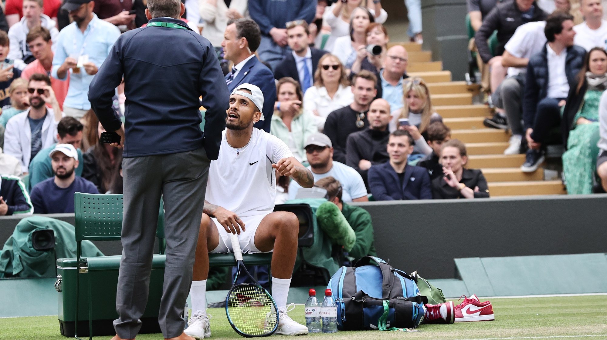 epa10048401 Nick Kyrgios of Australia complains to a supervisor as he plays against Stefanos Tsitsipas of Greece during their Men&#039;s third round match at the Wimbledon Championships, in Wimbledon, Britain, 02 July 2022.  EPA/KIERAN GALVIN   EDITORIAL USE ONLY