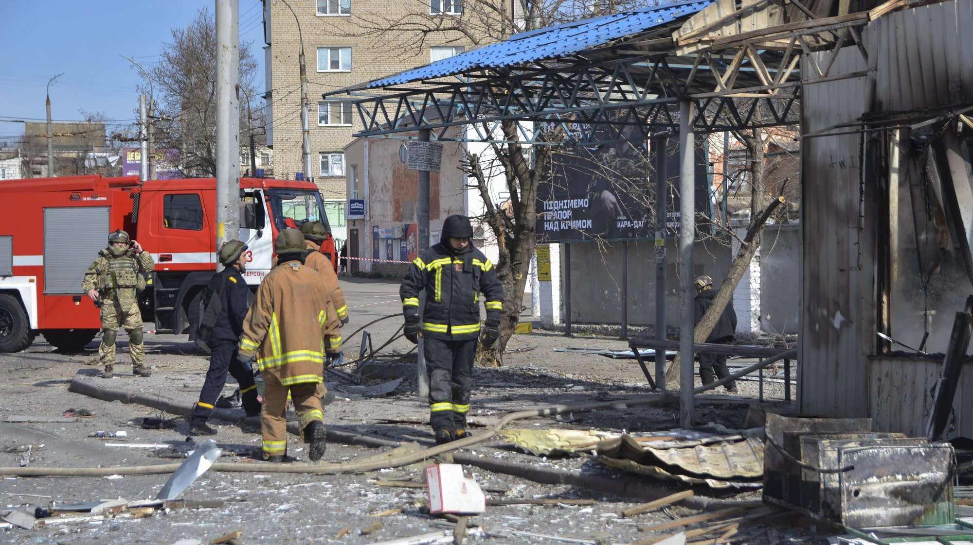 epa10511390 Rescuers work at a bus stop which was hit during a rocket attack in Kherson which resulted in the death of at least three people according to a spokesman from the President&#039;s office. Ukraine, 09 March 2023. Ukrainian authorities said on 09 March that Russia fired 81 missiles across the country targeting critical infrastructure and residential buildings. The country&#039;s Defense Ministry confirmed that 34 cruise missiles were shot down. According to Ukraine&#039;s nuclear operator Energoatom, the Zaporizhzhia nuclear power plant (NPP) lost power as a result of the missile attacks, and was running on diesel generators.  EPA/IVAN ANTYPENKO