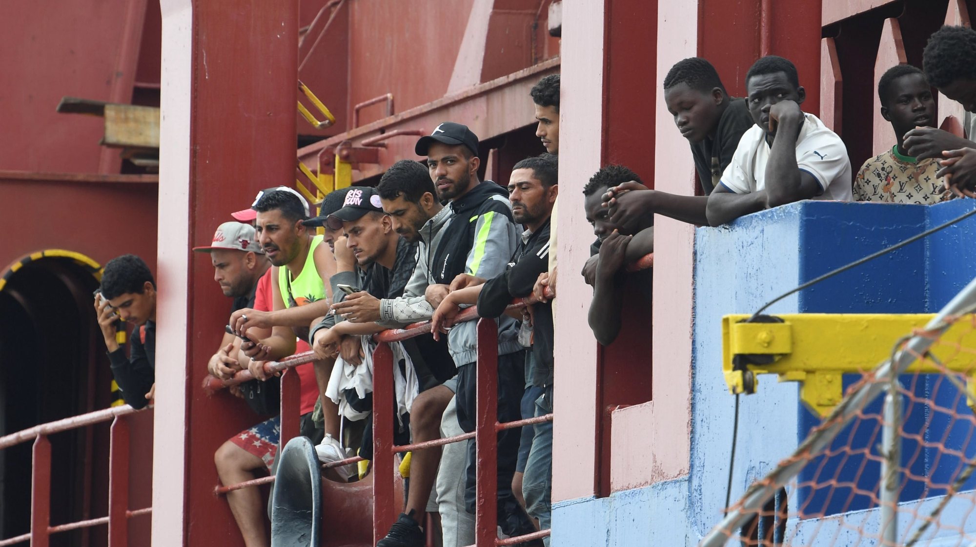 epa10859762 A group of migrants wait to disembark the Antigua &amp; Barbuda registered &#039;BBC EDGE&#039; General Cargo ship after the vessel docked in the port of Salerno, Italy, 14 September 2023 morning. A group of 184 migrants, mainly of North African origin, have been rescued at sea by the cargo ship. Of the 184 strong group 40 are reported to be minors with five of them unaccompanied. Most of the migrants are reported to come from Africa and, in particular, from Tunisia, Burkina Faso, Nigeria, the Comoros and Morocco.  EPA/MASSIMO PICA