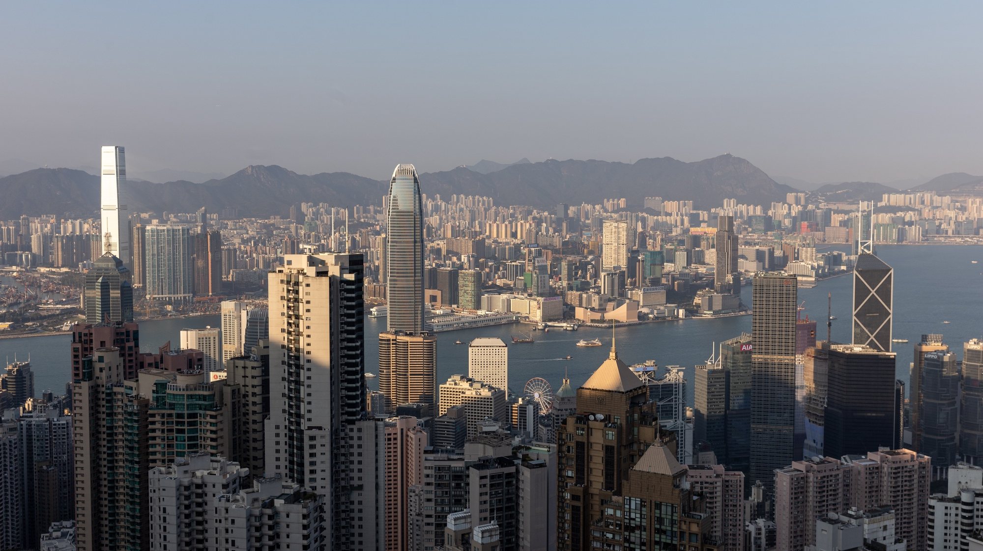 epa10494920 Residential and commercial buildings stand on Hong Kong Island and the Kowloon Peninsula city in Hong Kong, China, 28 February 2023. Hong Kong will scrap the mask mandate for all indoor and outdoor places after almost 3 years on 01 March 2023.  EPA/JEROME FAVRE