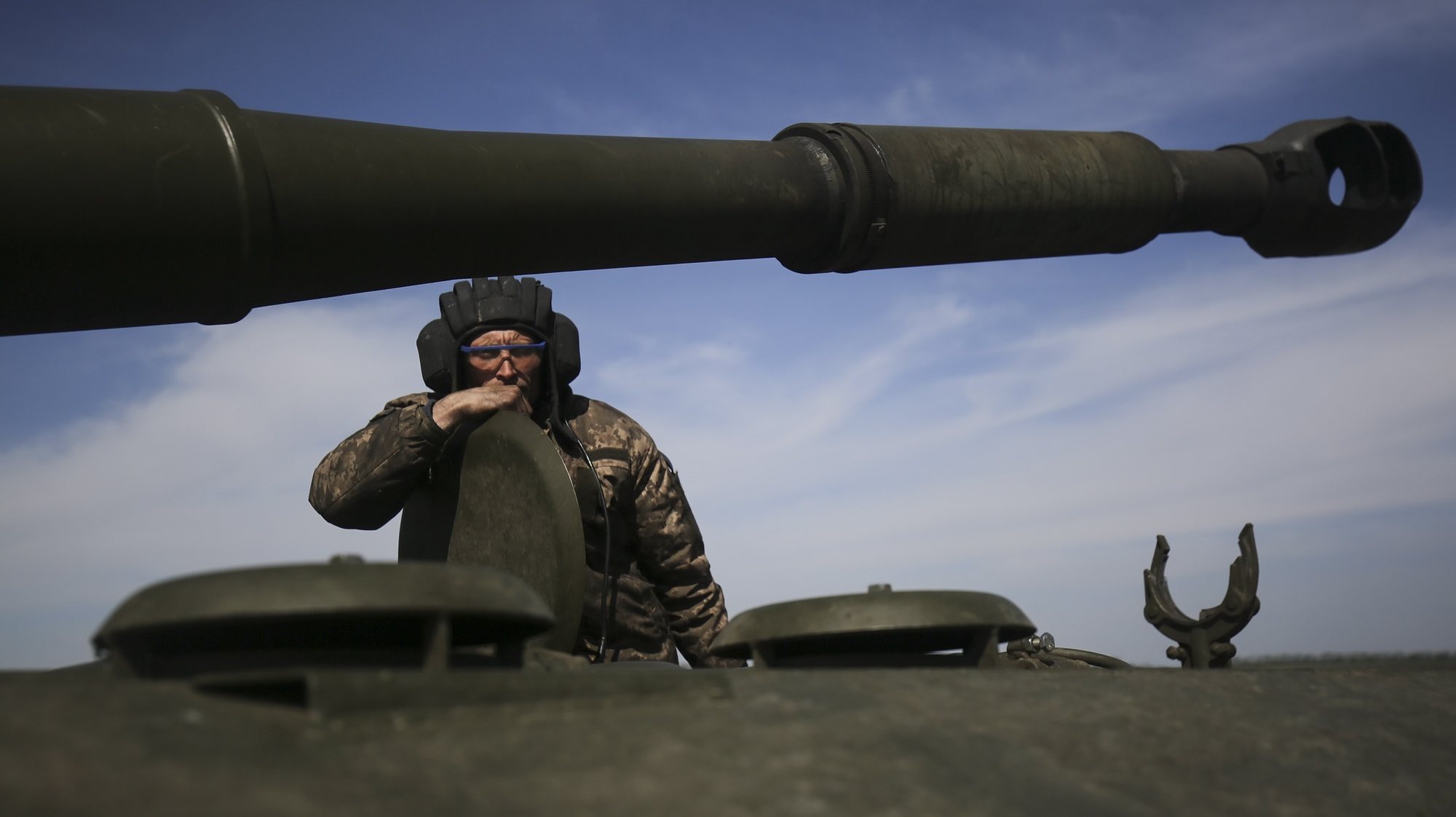 epa09931795 A Ukrainian serviceman looks on from a self-propelled howitzer, at an undisclosed area of Kharkiv, Ukraine, 07 May 2022. Russian troops entered Ukraine on 24 February, resulting in fighting and destruction in the country and fears of shortages in energy and food products globally. According to data released by the United Nations High Commission for the Refugees (UNHCR) on 06 May, over 5.8 million refugees have fled Ukraine seeking safety, protection and assistance in neighboring countries, making this the fastest growing refugee crisis since World War II. Western countries have responded with various sets of sanctions against Russian state majority owned companies and interests in a bid to bring an end to the conflict.  EPA/STRINGER