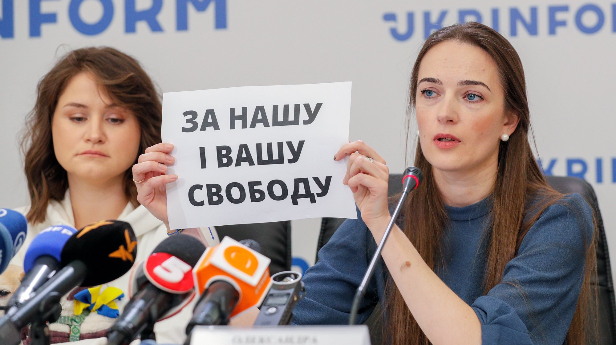 epa10230563 Oleksandra Matviychuk (R), Head of the Center for Civil Liberties, holds a sign reading &#039;For you and our freedom&#039; during a press conference in Kyiv (Kiev), Ukraine, 08 October 2022, after it was announced the organization is one of the three winners of the Nobel Peace Prize 2022. The Nobel Peace Prize 2022 has been awarded to human rights advocate Ales Bialiatski from Belarus, the Russian human rights organization Memorial and the Ukrainian human rights organization Center for Civil Liberties. The Norwegian Nobel Committee said in a statement on 07 October 2022, that by awarding the Nobel Peace Prize for 2022 to Bialiatski, Memorial and the Center for Civil Liberties, it wishes to &#039;honor three outstanding champions of human rights, democracy, and peaceful co-existence in the neighbor countries Belarus, Russia, and Ukraine.&#039;  EPA/SERGEY DOLZHENKO