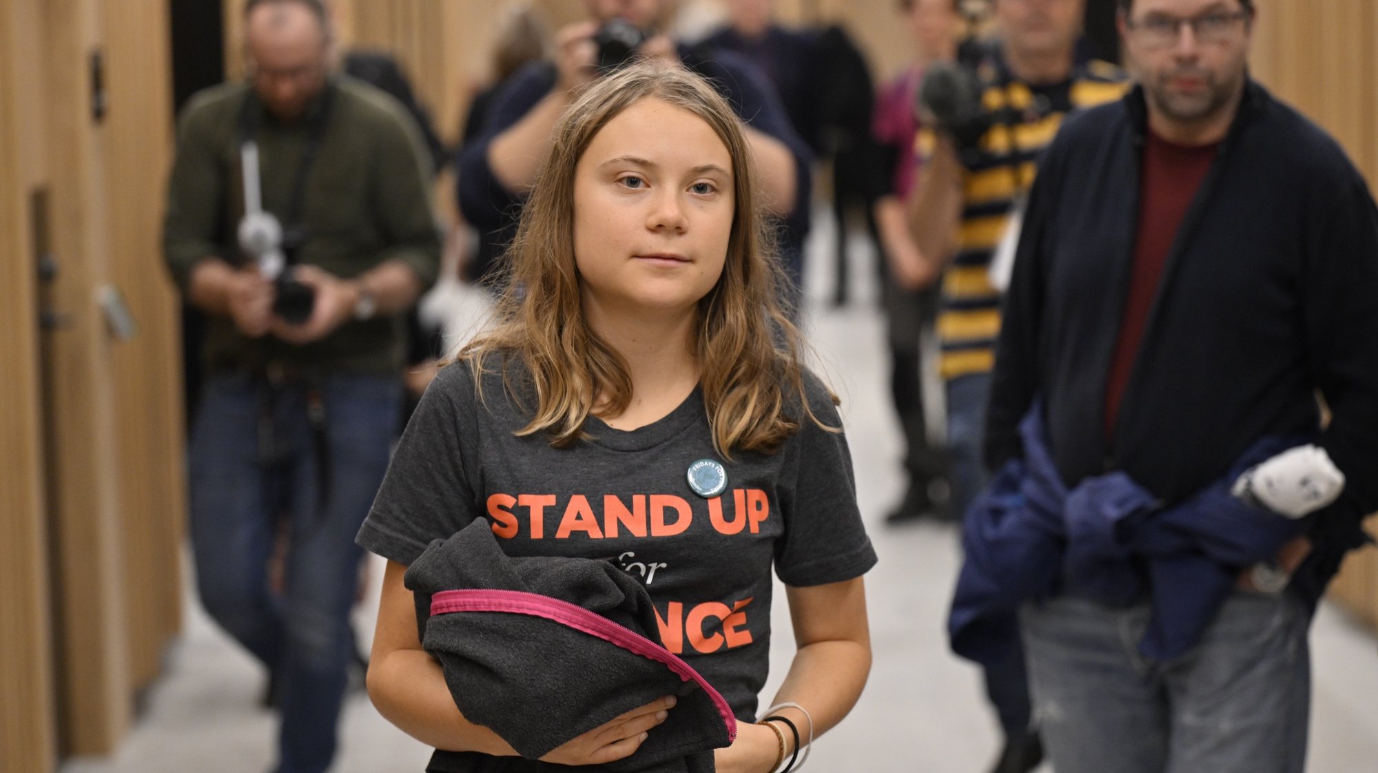 epa10913317 Swedish climate activist Greta Thunberg (C) appears at Malmo district court, in Malmo, Sweden, 11 October 2023. Thunberg is charged with disobedience to law enforcement for the second time.  EPA/Johan Nilsson/TT SWEDEN OUT