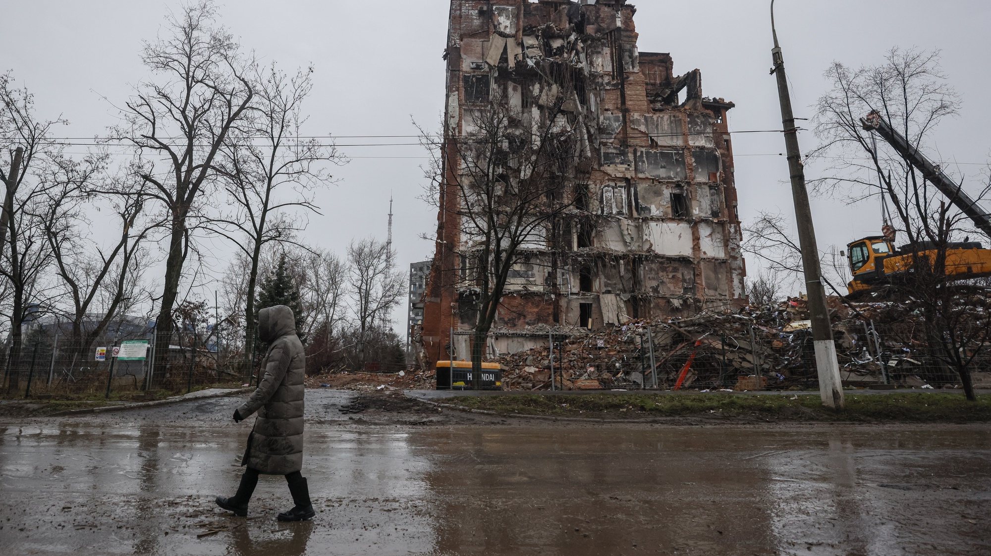 epa10362476 A local man walks in front of a destroyed building in downtown Mariupol, Ukraine, 12 December 2022. Mariupol had seen a long battle for its control between the Ukrainian forces and the Russian army and Russian backed separatist Donetsk Peopleâ€™s Republic (DPR) as well as a siege, the hostilities lasted from February to the end of May 2022 killing thousands of people and destroying most of the city in the process. According to the DPR government which took control after May 2022, more than five thousand builders are currently working in Mariupol, they expect the city to be completely rebuilt in three years&#039; time.  EPA/SERGEI ILNITSKY
