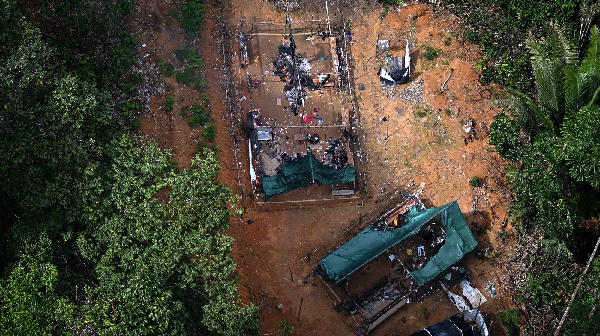 epa10469401 An illegal miners camp is seen during an operation by Brazilian authorities against the advance of deforestation and illegal mining in the Itaituba II Environmental Forest, Brazil, 15 February 2023. The surroundings of Itaituba, in the state of Para in northern Brazil, is one of the areas of the jungle most affected by deforestation.  EPA/Andre Borges