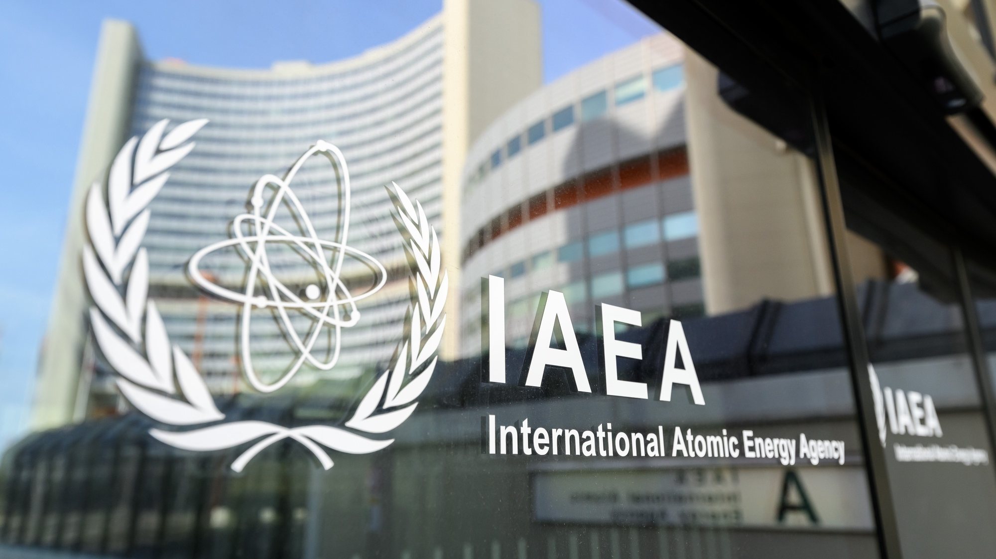 epa11272479 The UNO City is reflected on a door with the IAEA Logo before an International Atomic Energy Agency (IAEA) Board of Governors meeting at the IAEA headquarters of the United Nations seat in Vienna, Austria, 11 April 2024.  EPA/MAX SLOVENCIK