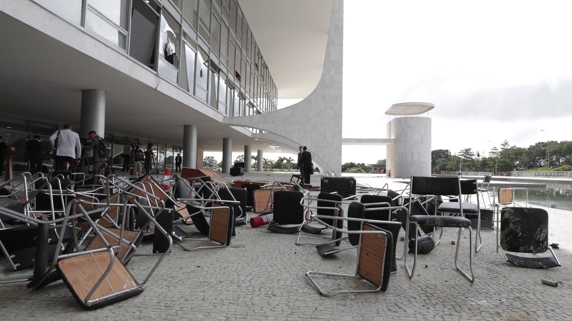 epa10396800 Officials inspect the damage to the Planalto Palace after Bolsonaro supporters took over the Plaza de los Tres Poderes (Square of the Three Powers) to invade government buildings, in Brasilia, Brazil, 09 January 2023. Hundreds of supporters of former Brazilian President Jair Bolsonaro on 08 January invaded the headquarters of the National Congress, and also Supreme Court and the Planalto Palace, seat of the Presidency of the Republic, in a demonstration calling for a military intervention to overthrow President Luiz Inacio Lula da Silva. The crowd broke through the cordons of security forces and forced their way to the roof of the buildings of the Chamber of Deputies and the Senate, and some entered inside the legislative headquarters. So far, authorities detained some people involved in the violent acts which were widely condemned by all Brazilian institutions and by the international community.  EPA/ANDRE COELHO