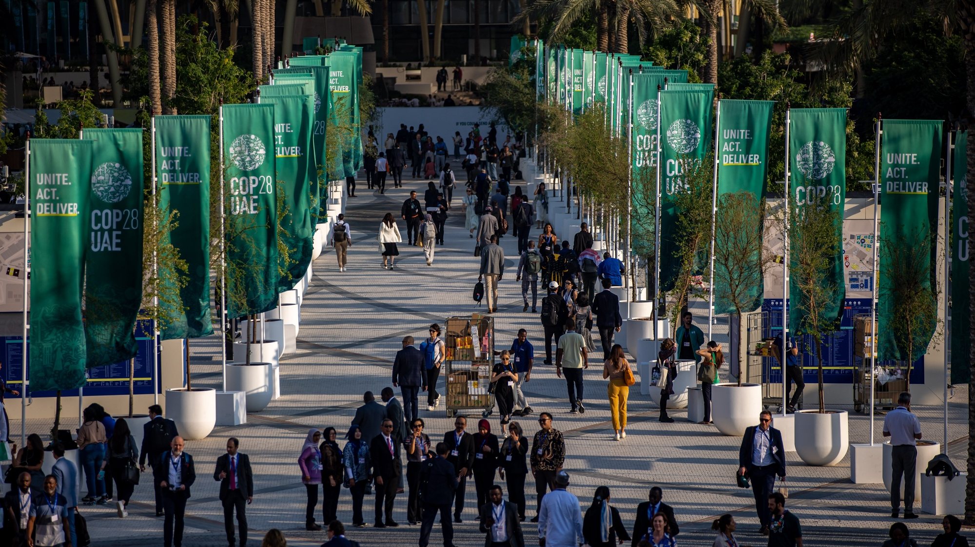 epa11013697 Participants walk at Expo City Dubai, the venue of the 2023 United Nations Climate Change Conference (COP28), in Dubai, United Arab Emirates, 06 December 2023. The 2023 United Nations Climate Change Conference (COP28), runs from 30 November to 12 December, and is expected to host one of the largest number of participants in the annual global climate conference as over 70,000 estimated attendees, including the member states of the UN Framework Convention on Climate Change (UNFCCC), business leaders, young people, climate scientists, Indigenous Peoples and other relevant stakeholders will attend.  EPA/MARTIN DIVISEK
